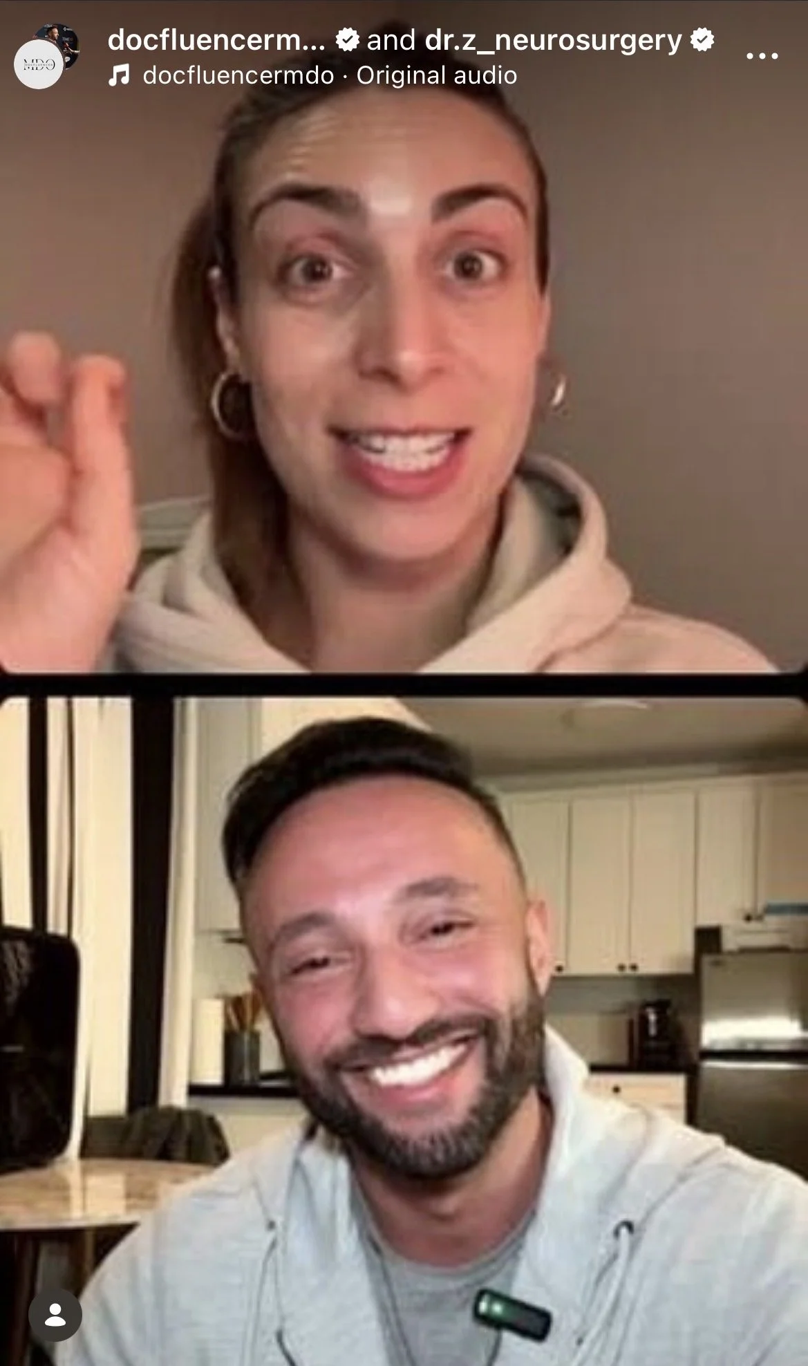 A split-screen video call showing a woman with light skin, light brown hair in a ponytail, wearing hoop earrings and a beige hoodie, smiling and making an OK gesture, and a man with light skin, dark hair, beard, wearing a headset and a gray hoodie, smiling in a kitchen setting.