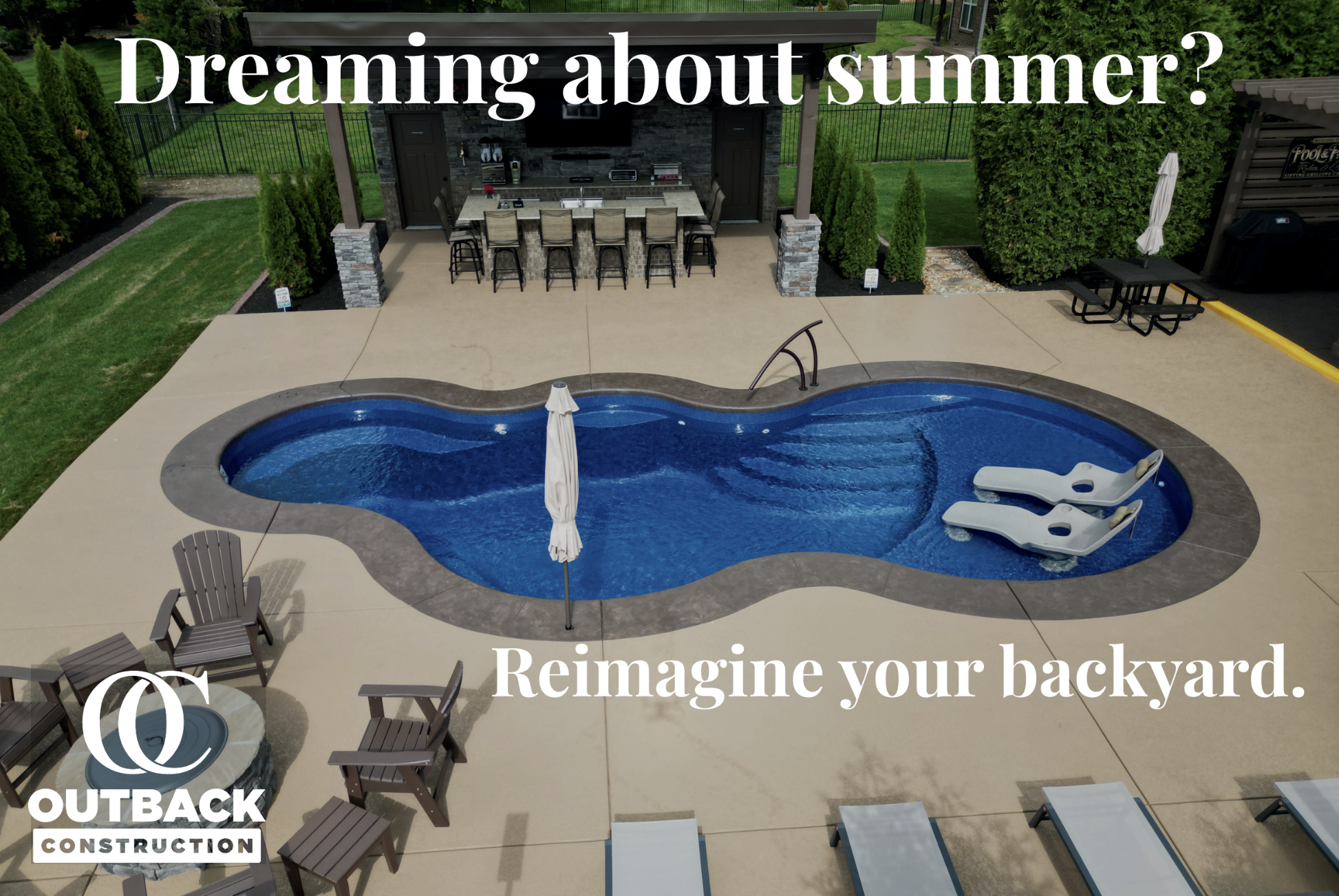 An outdoor backyard patio with a pool, lounge chairs, and a shaded area with a bar and seating. Text overlay reads, 'Dreaming about summer? Reimagine your backyard.' The logo of Outback Construction is in the bottom left corner.