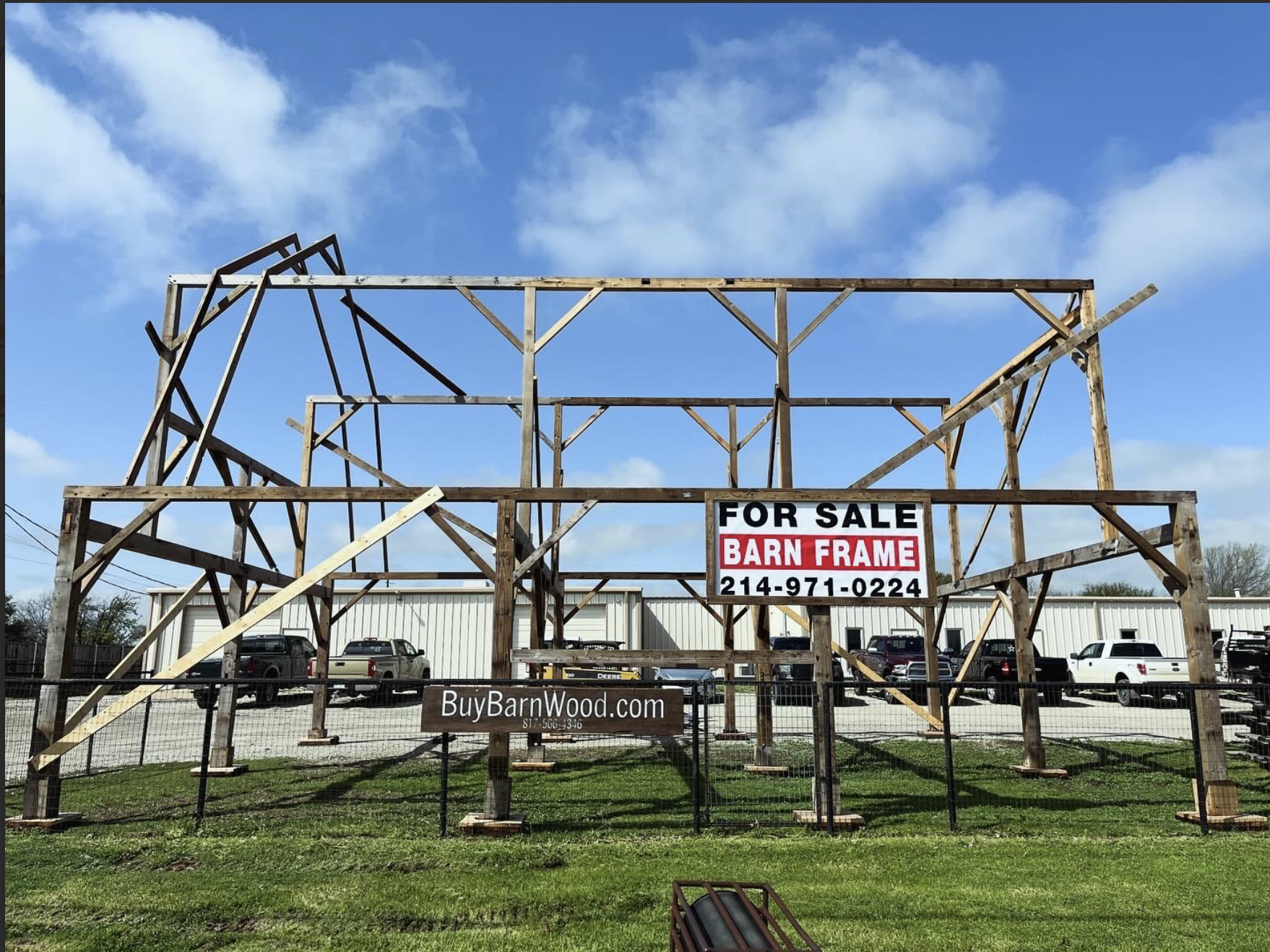 Wooden barn frame under construction with a
