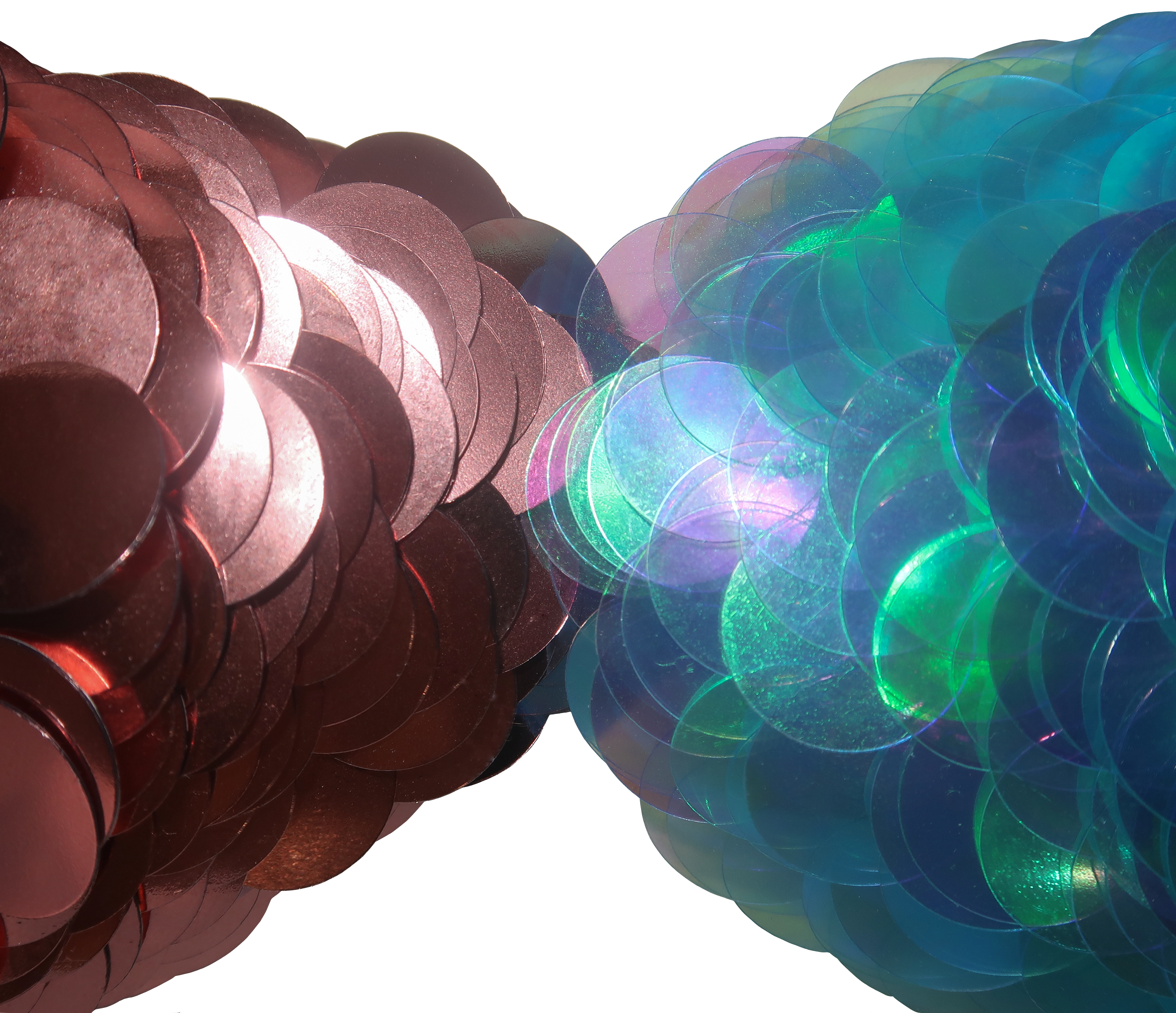 Close-up of red and green shimmering sequins arranged in overlapping layers.