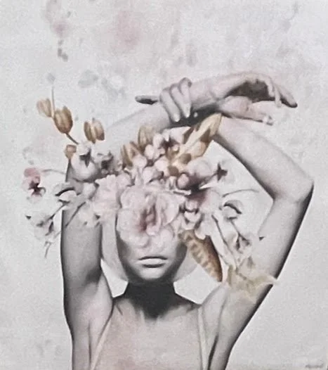 A woman with flowers covering her head