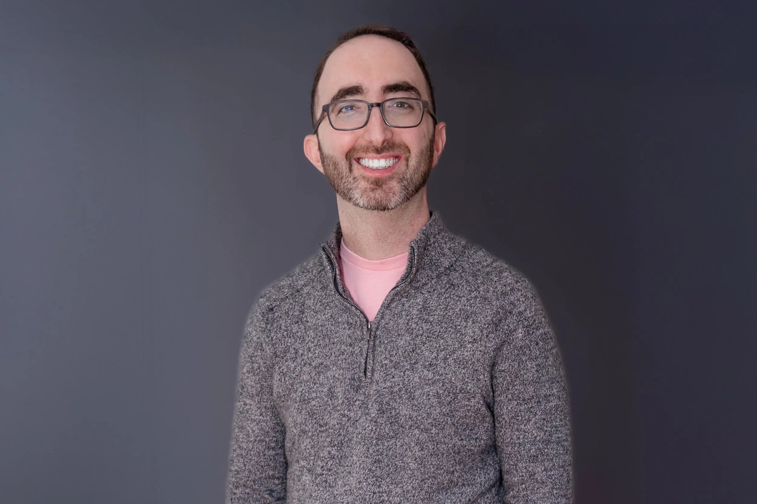 Jeremy Richfield, LPC, smiling professional headshot in an outdoor setting with greenery