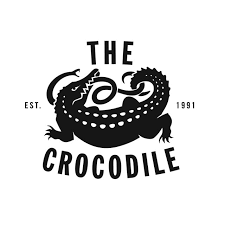 Logo featuring a crocodile with the text 'The Croc(c)odile' and 'EST. 1991'.