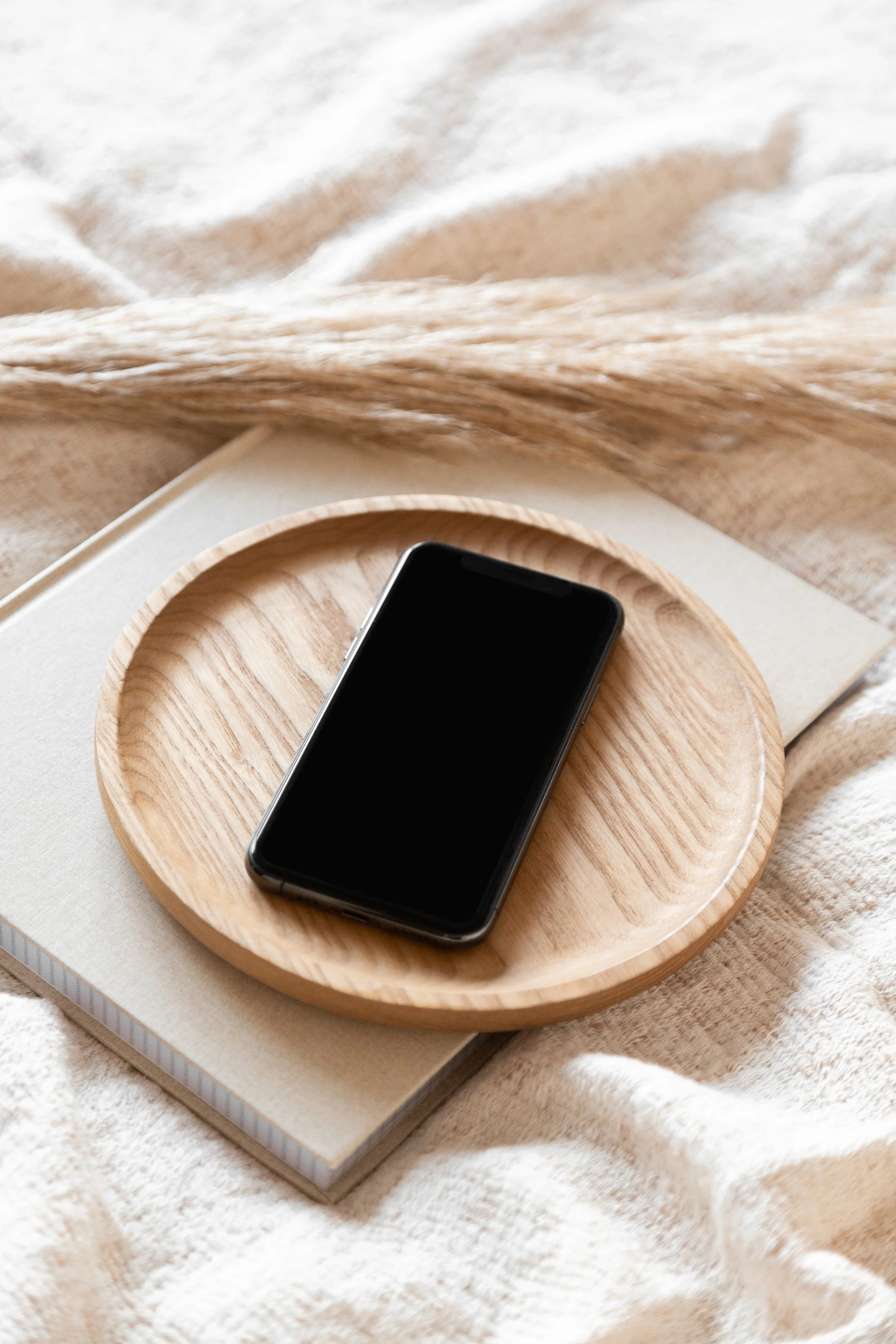 Urban Sense Wellness contact page icon with smartphone and neutral branding for easy naturopath bookings in Melbourne.