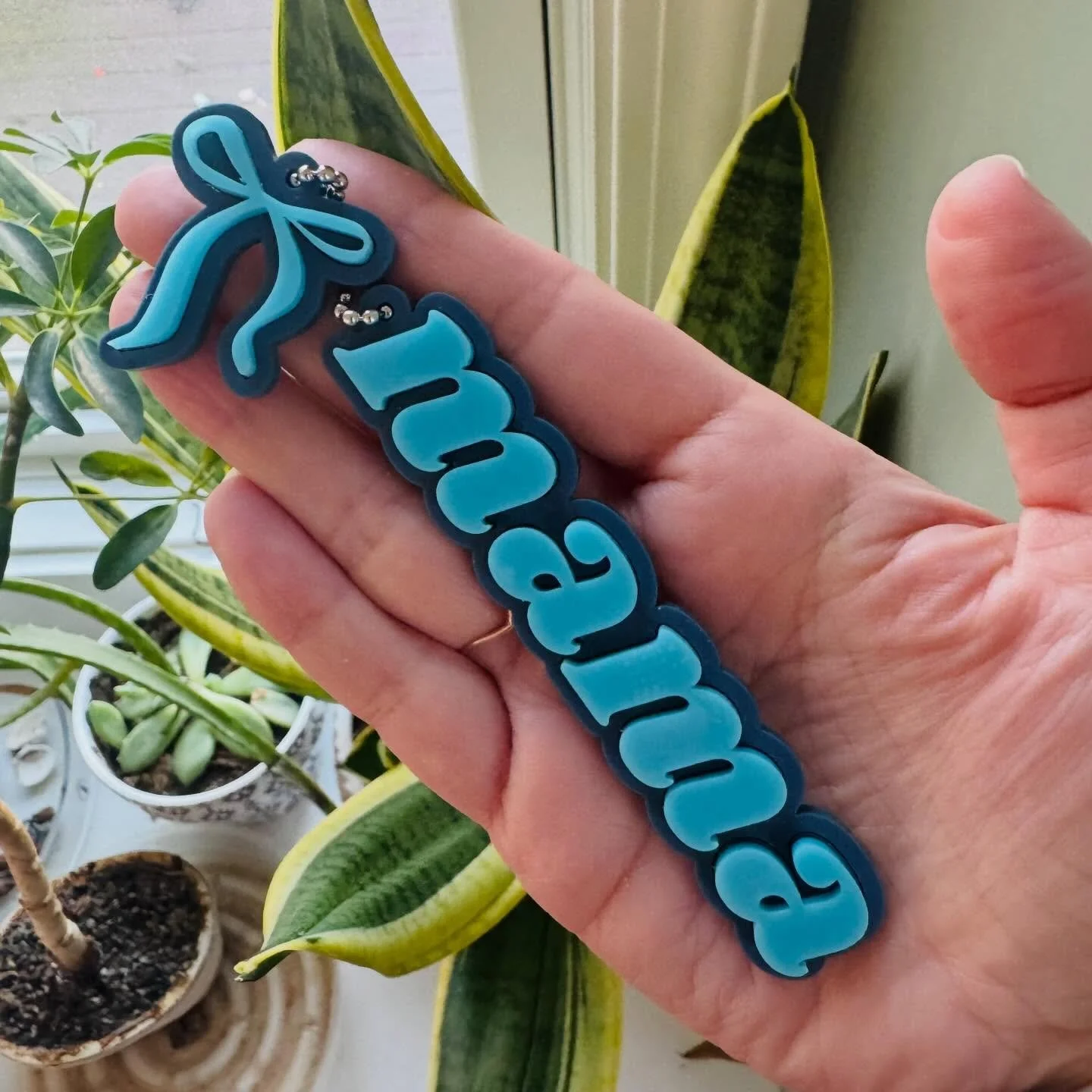 Testing new ideas for a little &ldquo;mama&rdquo; moment with a bow 🎀

Do we love it? Or are we thinking different colors&hellip; different charms&hellip; maybe both?

What would you love to see on a keychain?  in my experimental era and taking note