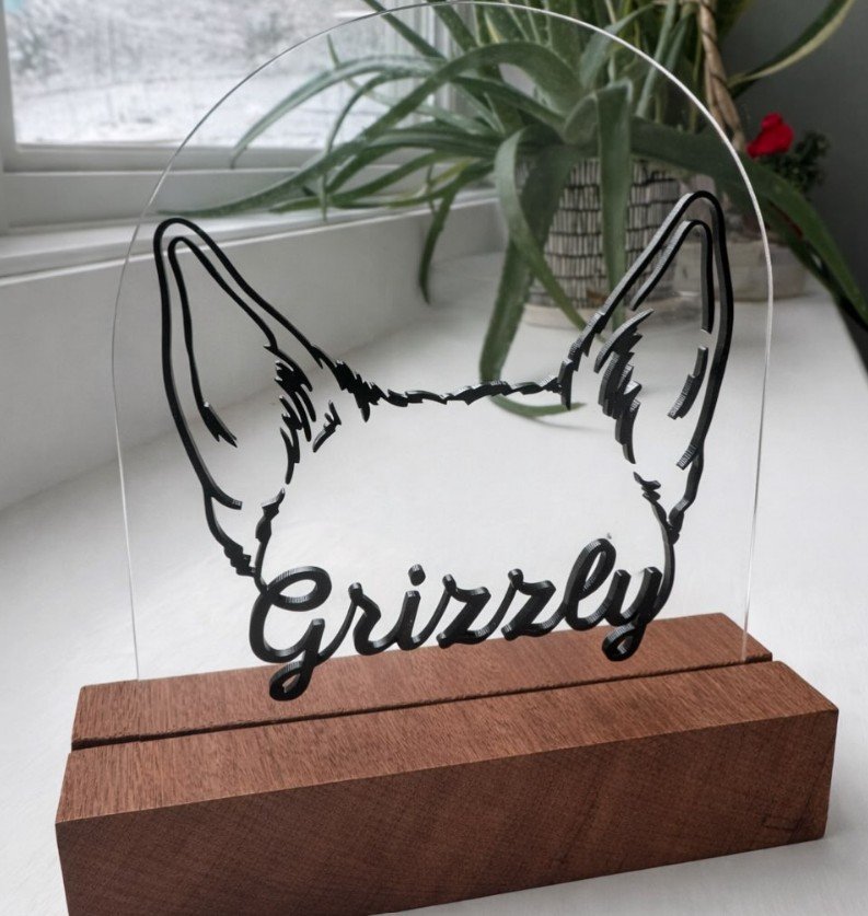 Custom laser outline of dog for a pet tribute