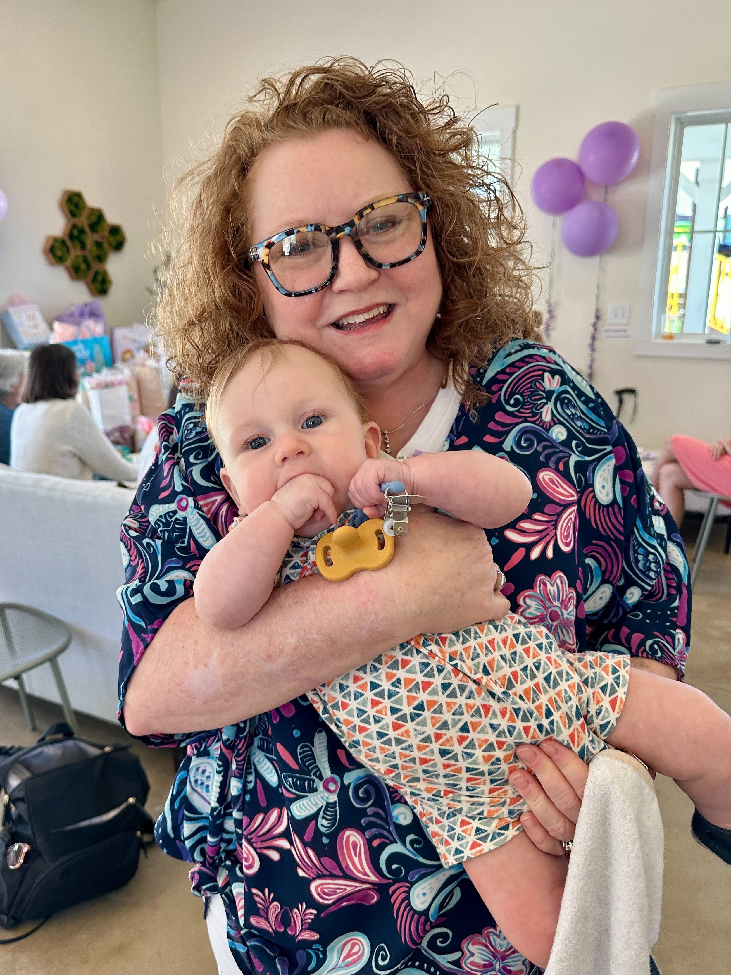 Cathy with a cute, happy baby