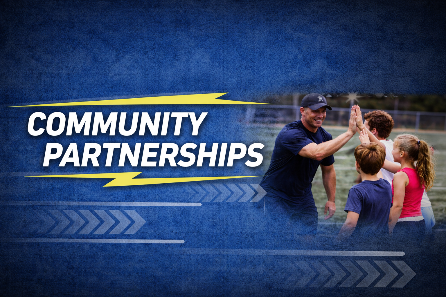 A group of children high-fiving a smiling man on a sports field during daytime, with the text 'Community Partnerships' on a blue background.