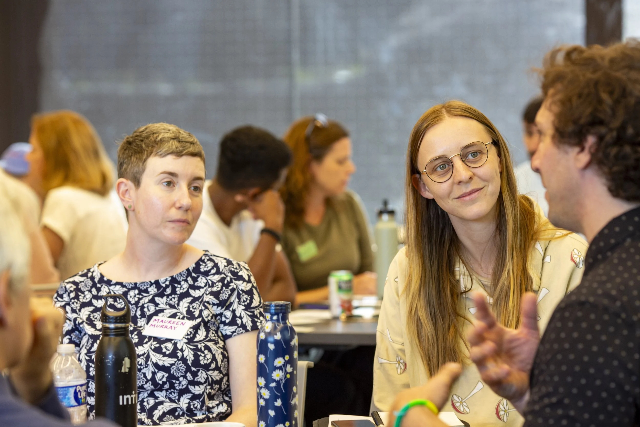 a group of ecologists talking to eachother at a wildlife summit
