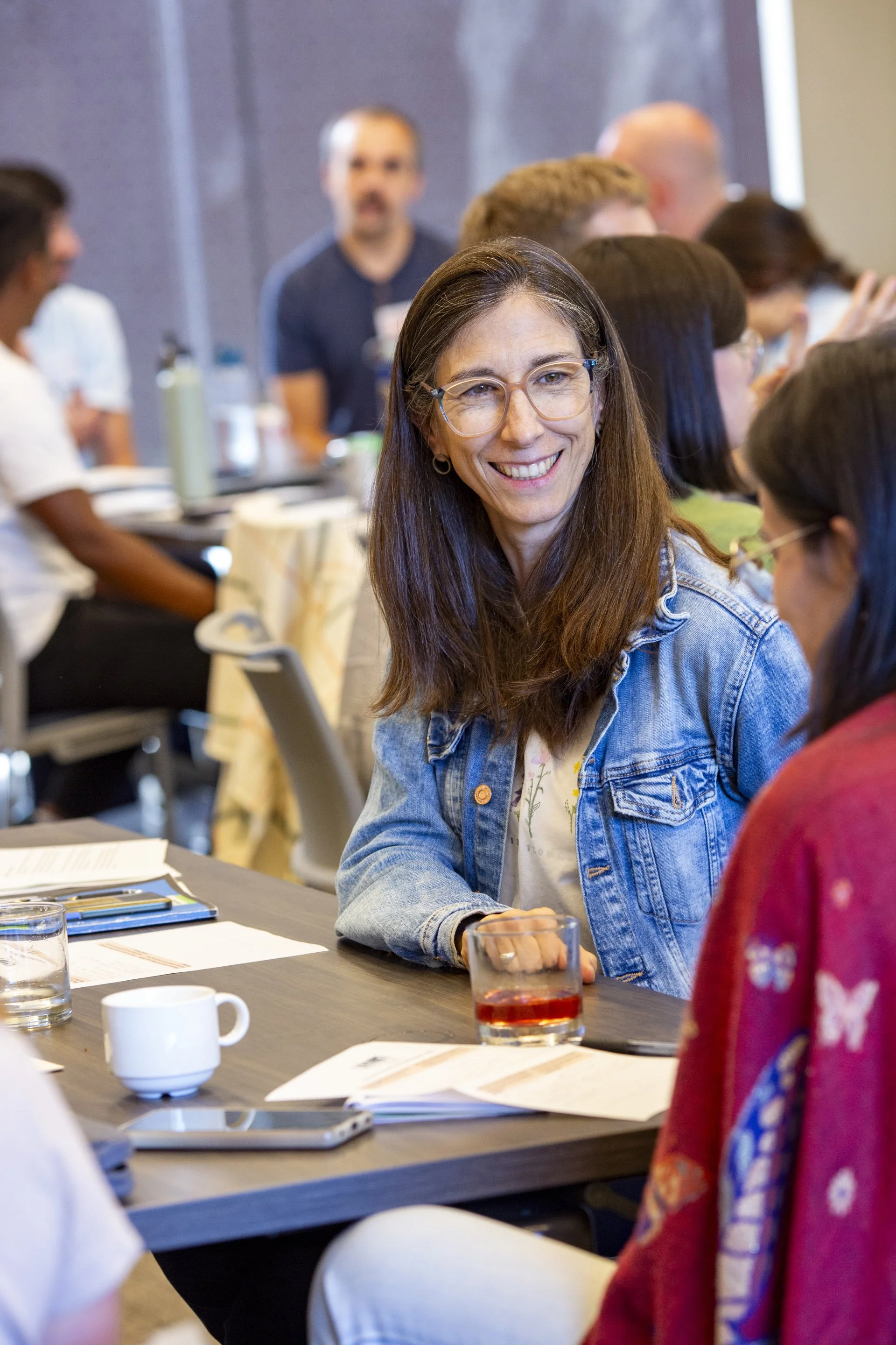 A woman talking to other wildlife biologists 