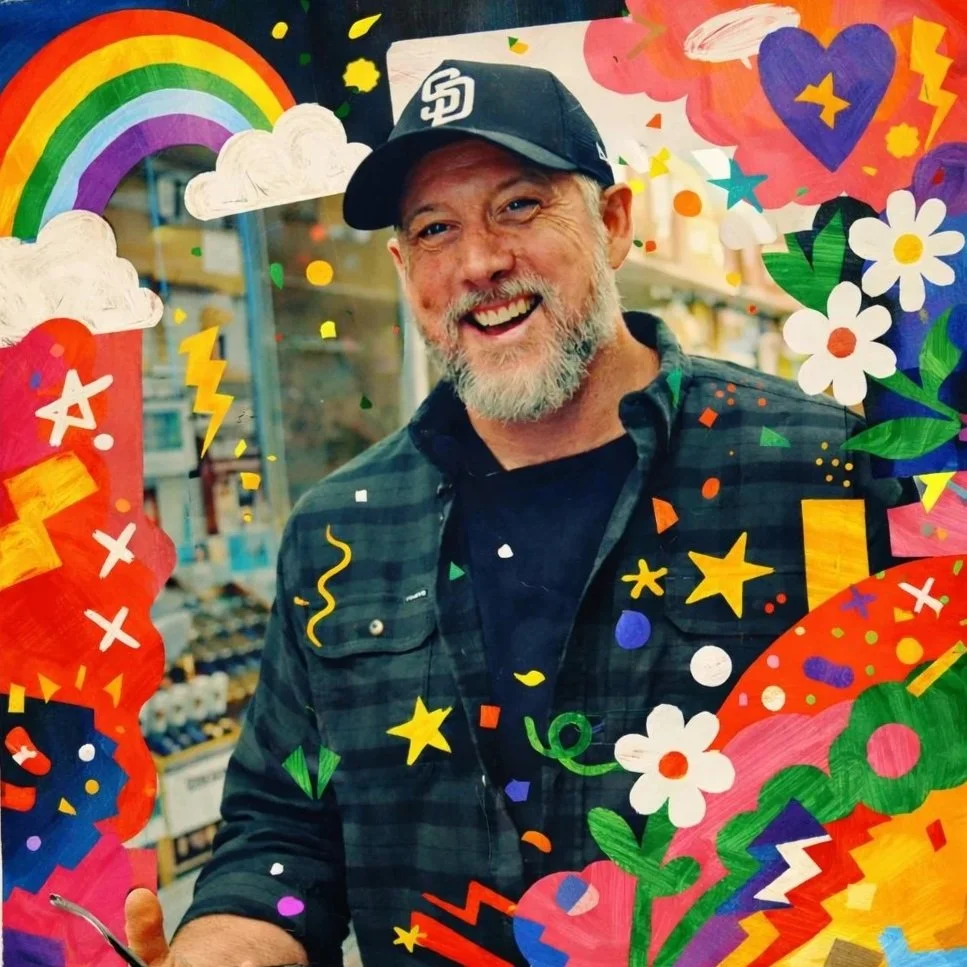 A smiling man with a beard and baseball cap standing behind vibrant, colorful illustrations of rainbows, clouds, stars, flowers, and abstract shapes.