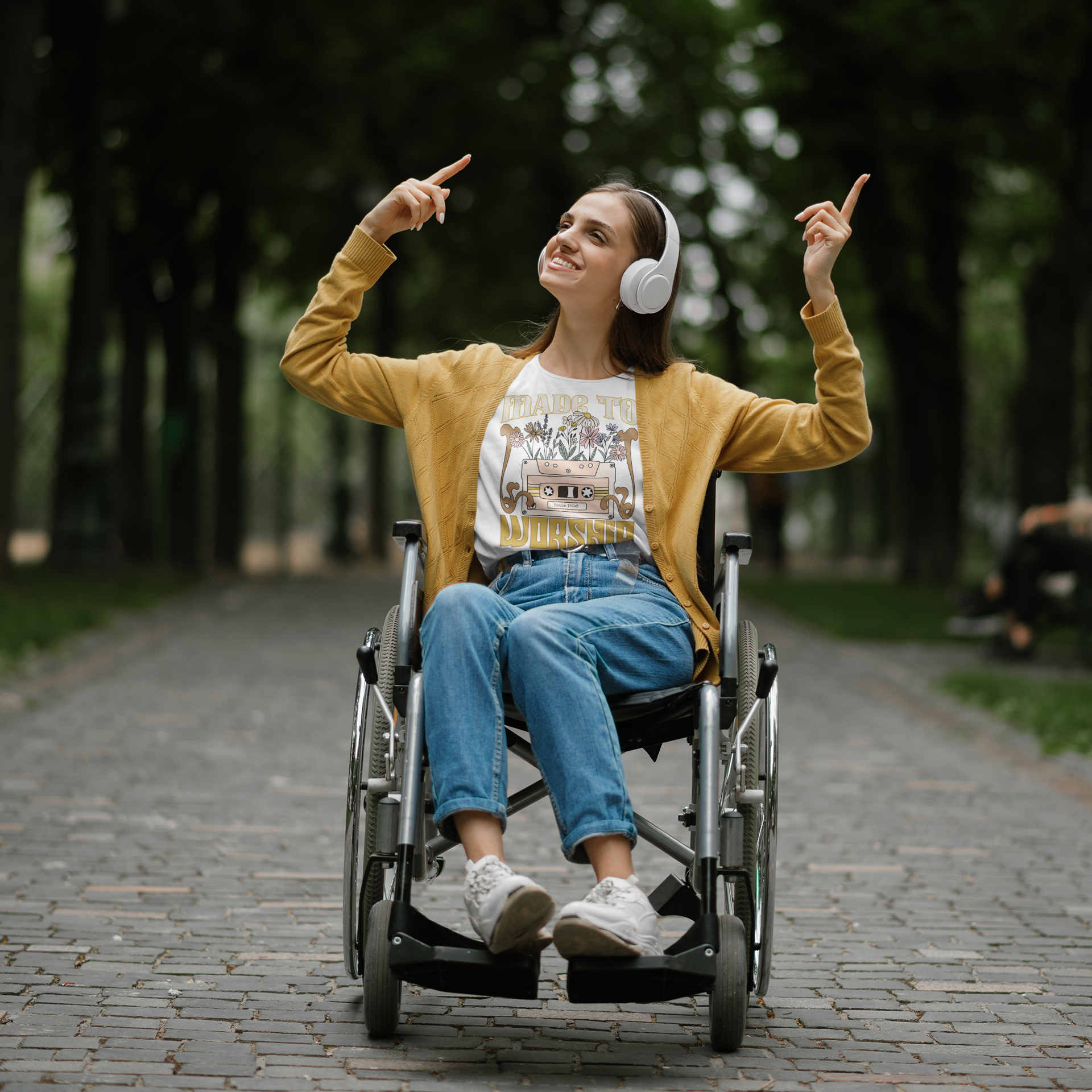t-shirt-mockup-of-a-happy-woman-listening-to-music-and-using-a-wheelchair-m18480-r-el2.png