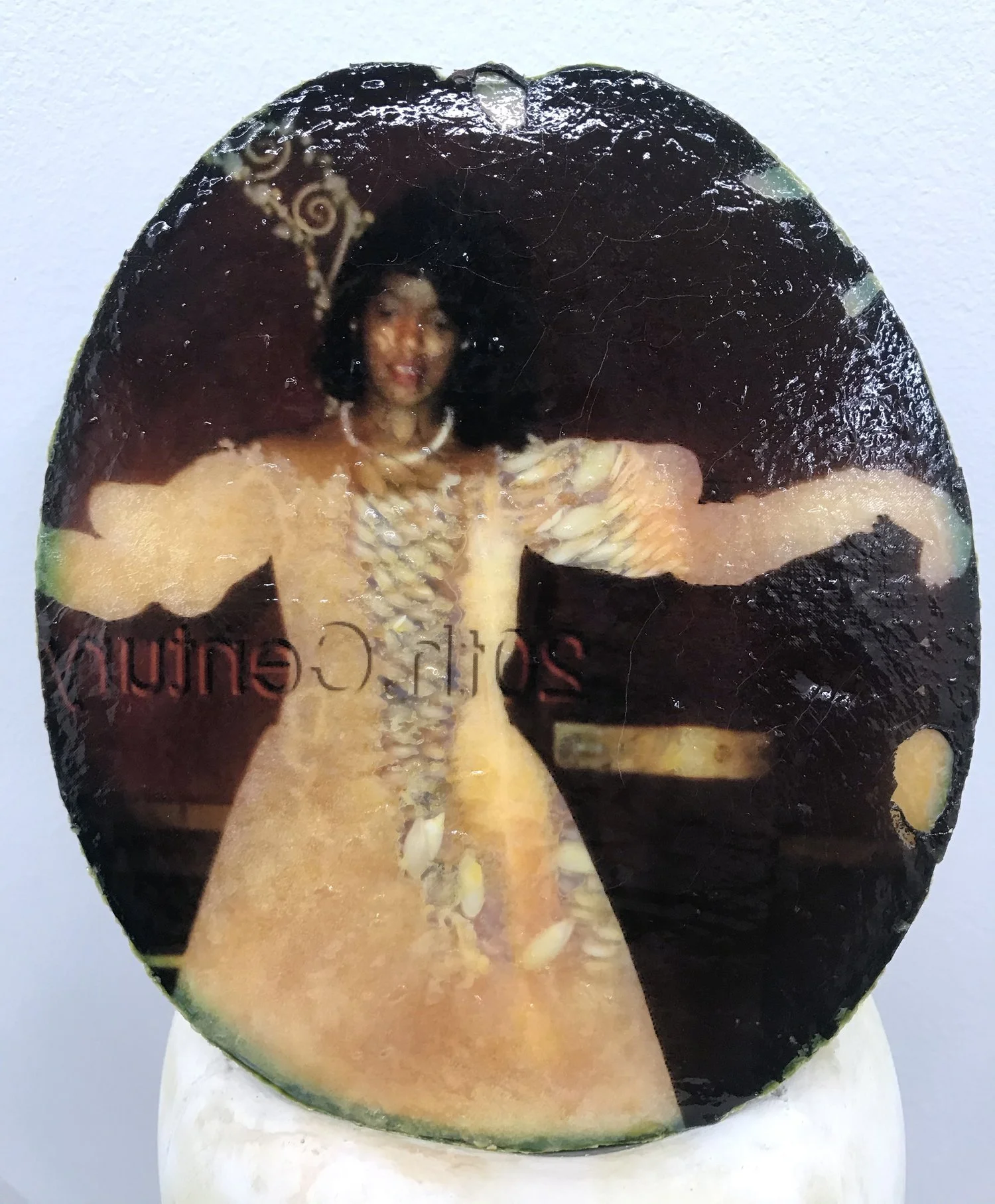 Keeper (detail), 2021, Materials: Found photograph, melon, collagen, glass beads, plaster, plexiglass, resin, hardware, 29" x 20" x 8 "