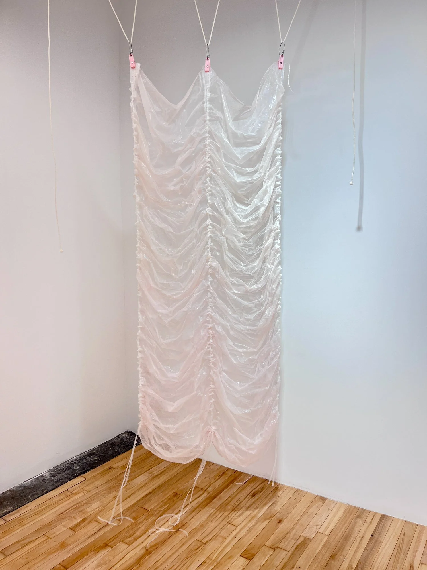 Pinkie (study), 2025. Materials: collagen, silicone, ribbon. 68" x 36". Installed in Hesse Flatow, NYC.