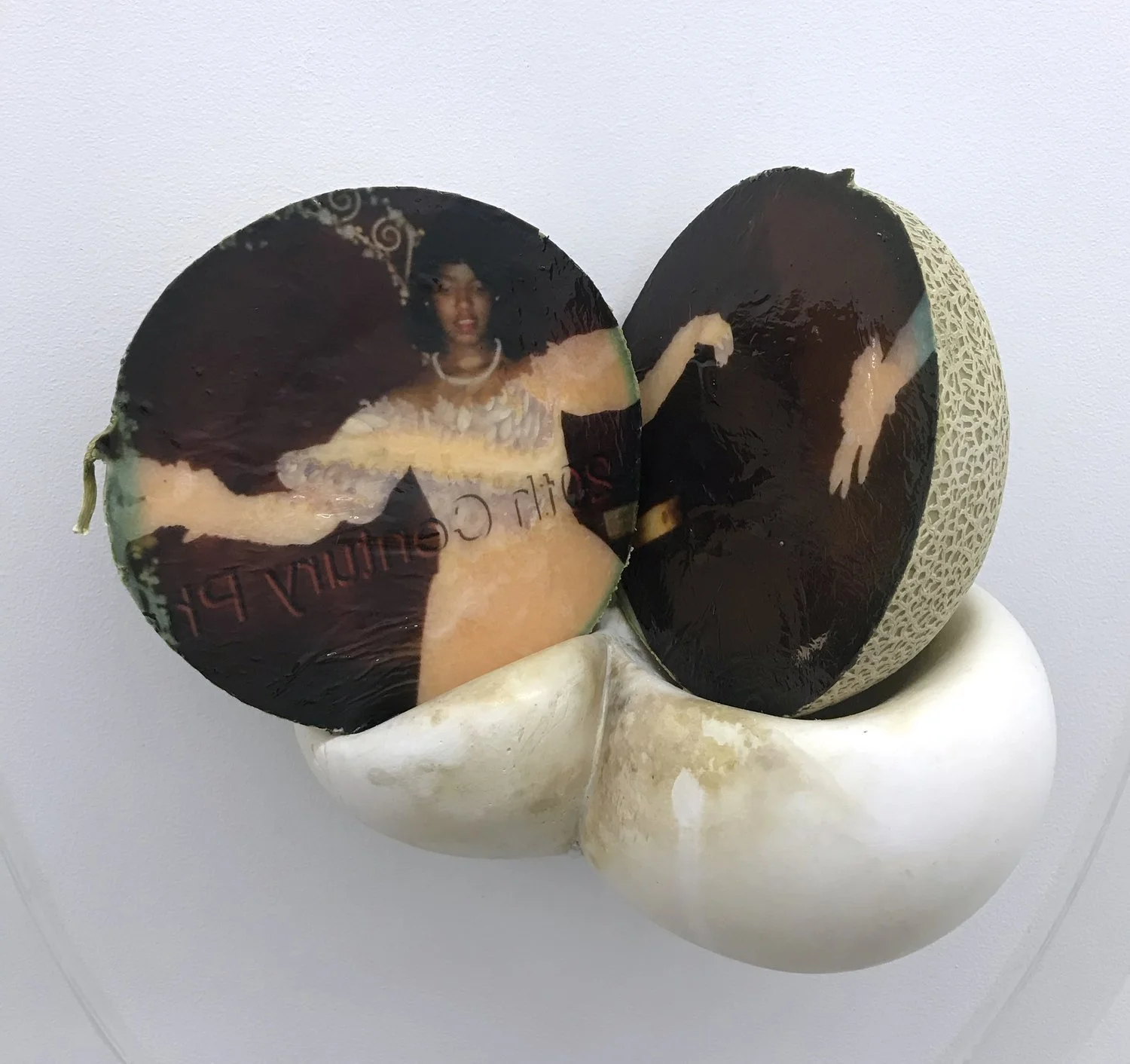 Keeper (detail), 2021, Materials: Found photograph, melon, collagen, glass beads, plaster, plexiglass, resin, hardware, 29" x 20" x 8 "