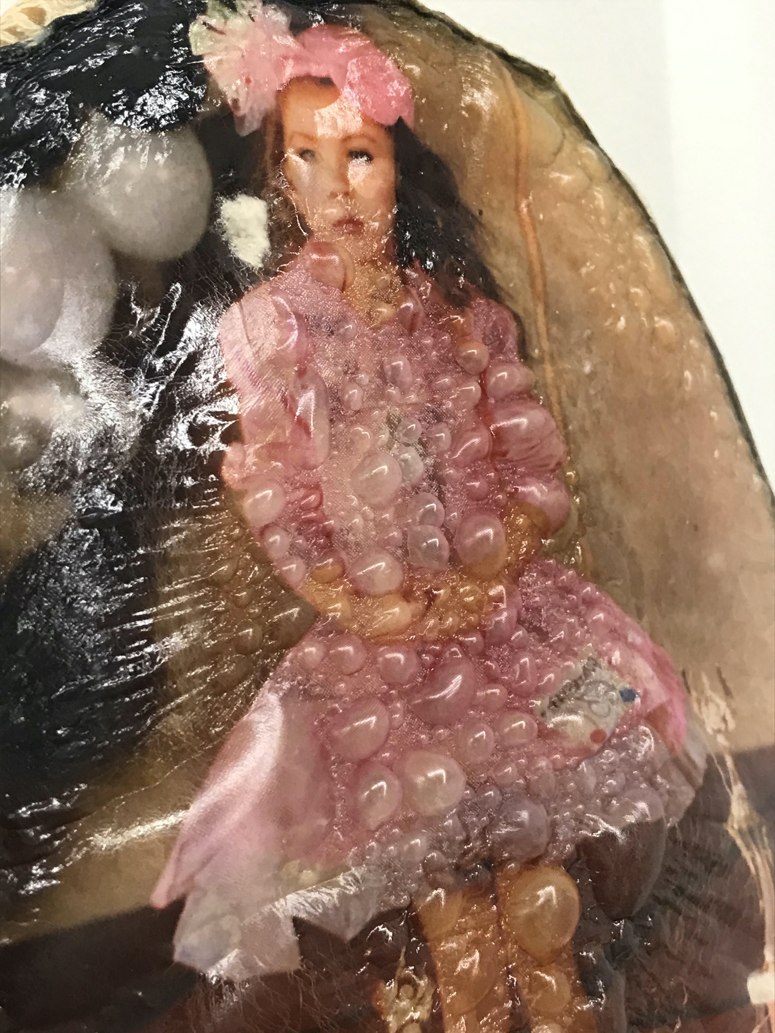 Keeper (detail), 2021, Materials: Found photograph, melon, collagen, glass beads, plaster, plexiglass, resin, hardware, 29" x 20" x 8 "