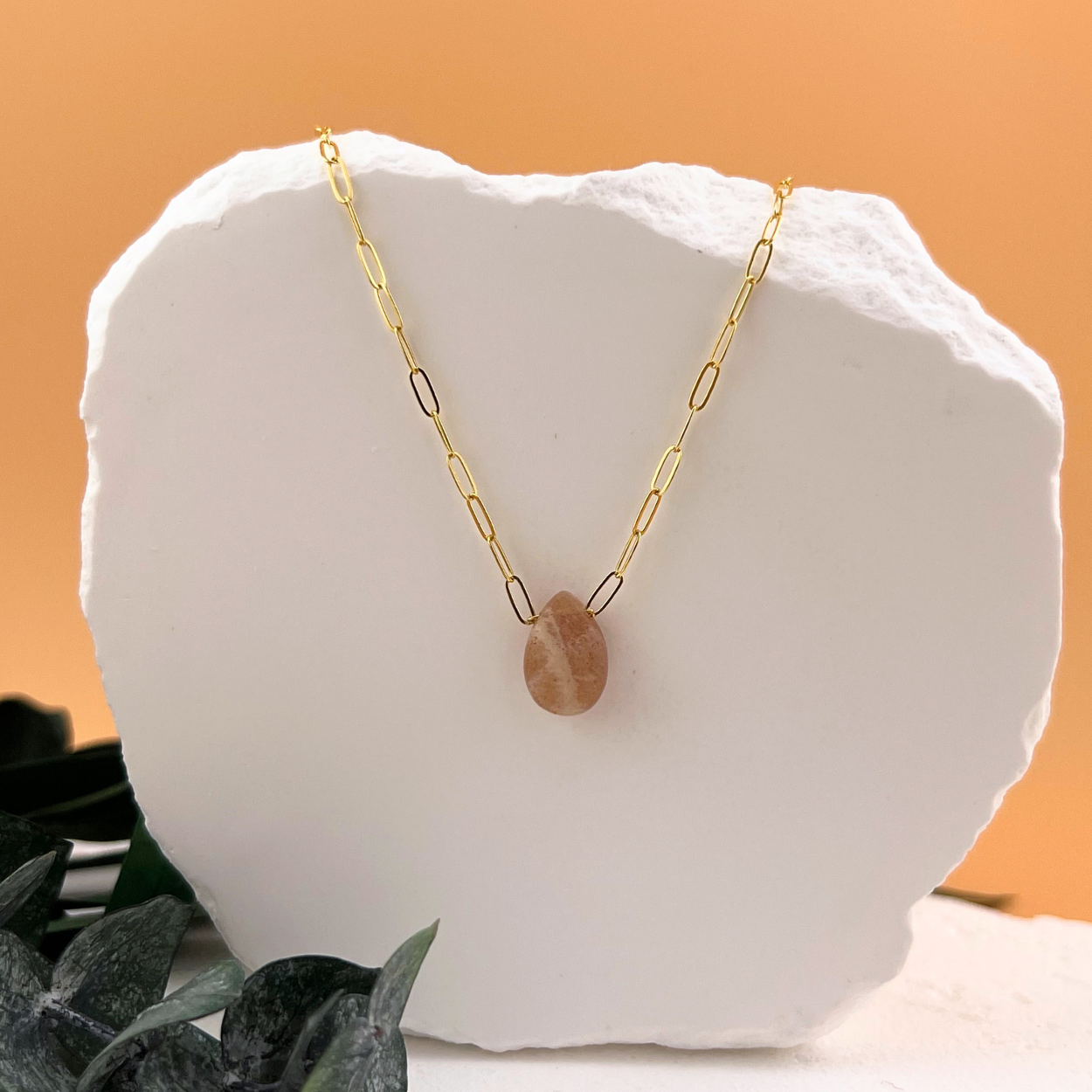 Peach moonstone teardrop pendant necklace on 14kt gold fill paperclip chain.