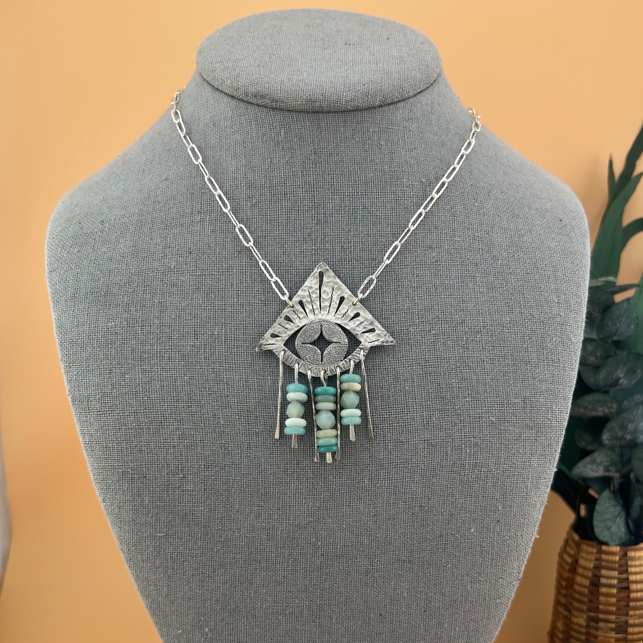 Handcrafted Mystic Eye Necklace featuring a saw-pierced sterling silver eye with amazonite bead fringe on a hammered paperclip chain.