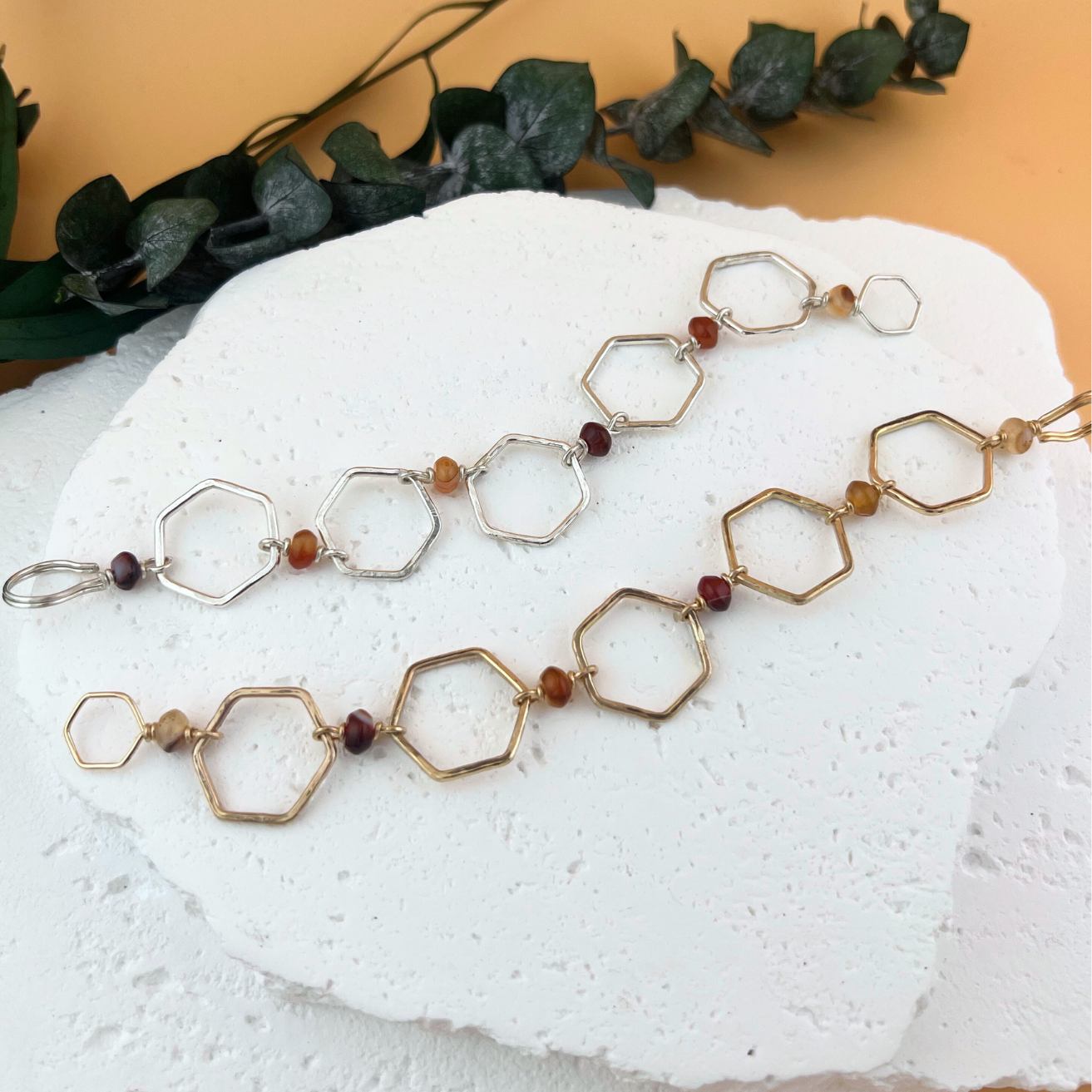 Handcrafted hexagon link bracelet with red banded agate beads in gold fill and sterling silver.