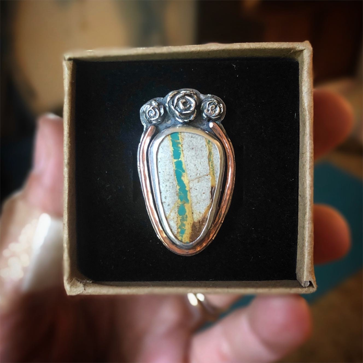 Custom Royston Turquoise ring in sterling silver with rose and copper accents.