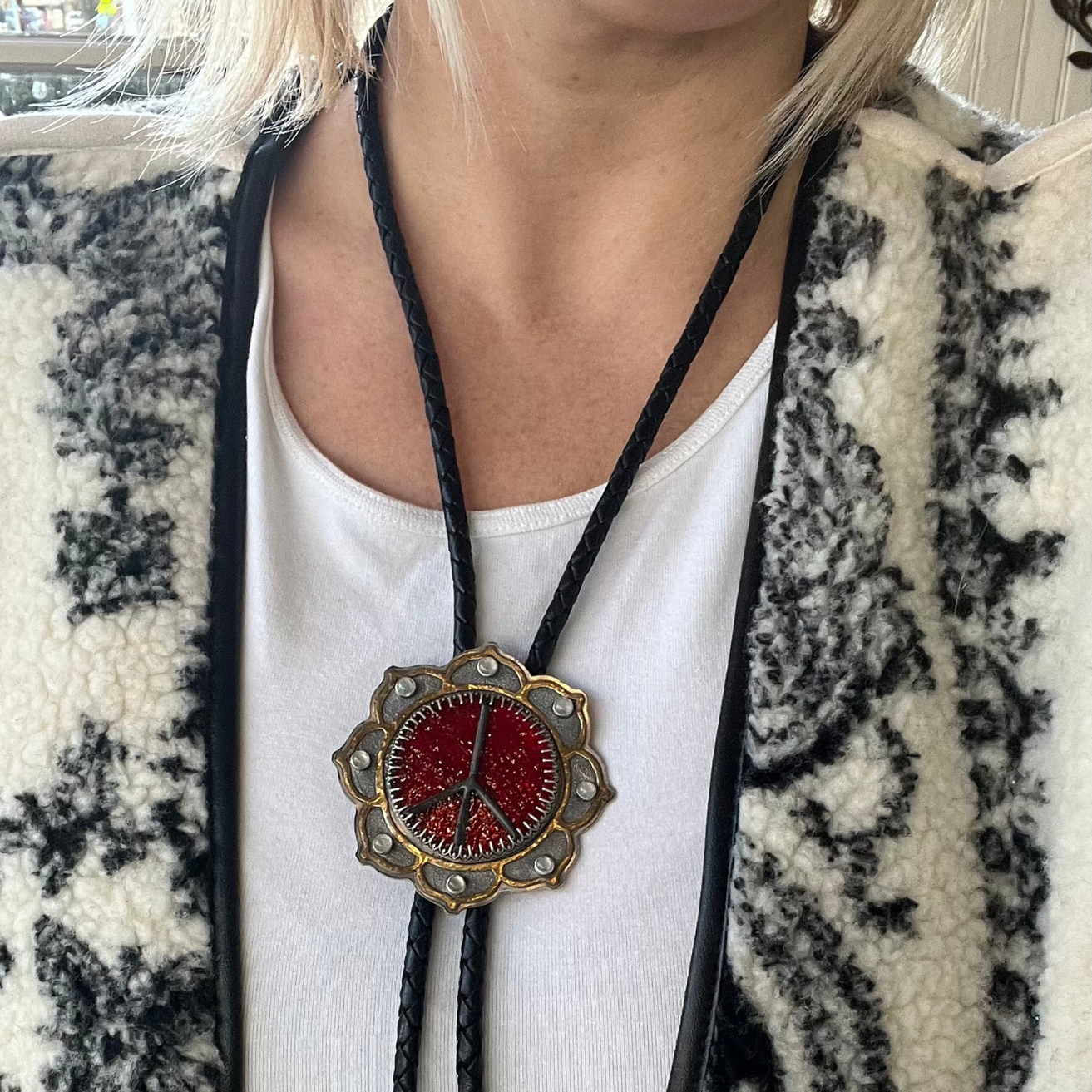 Red stained glass Peace Portal bolo tie accented with rainbow moonstone, shown worn and styled as a statement necklace.