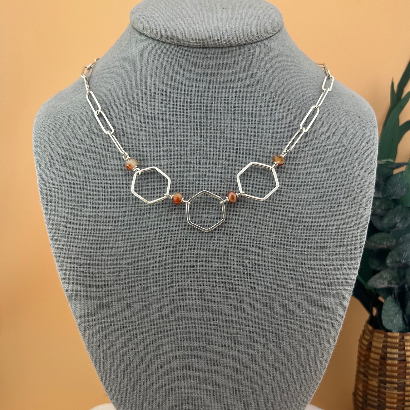 Hex + Stone necklace featuring hammered hexagons links with banded agate beading in sterling silver.