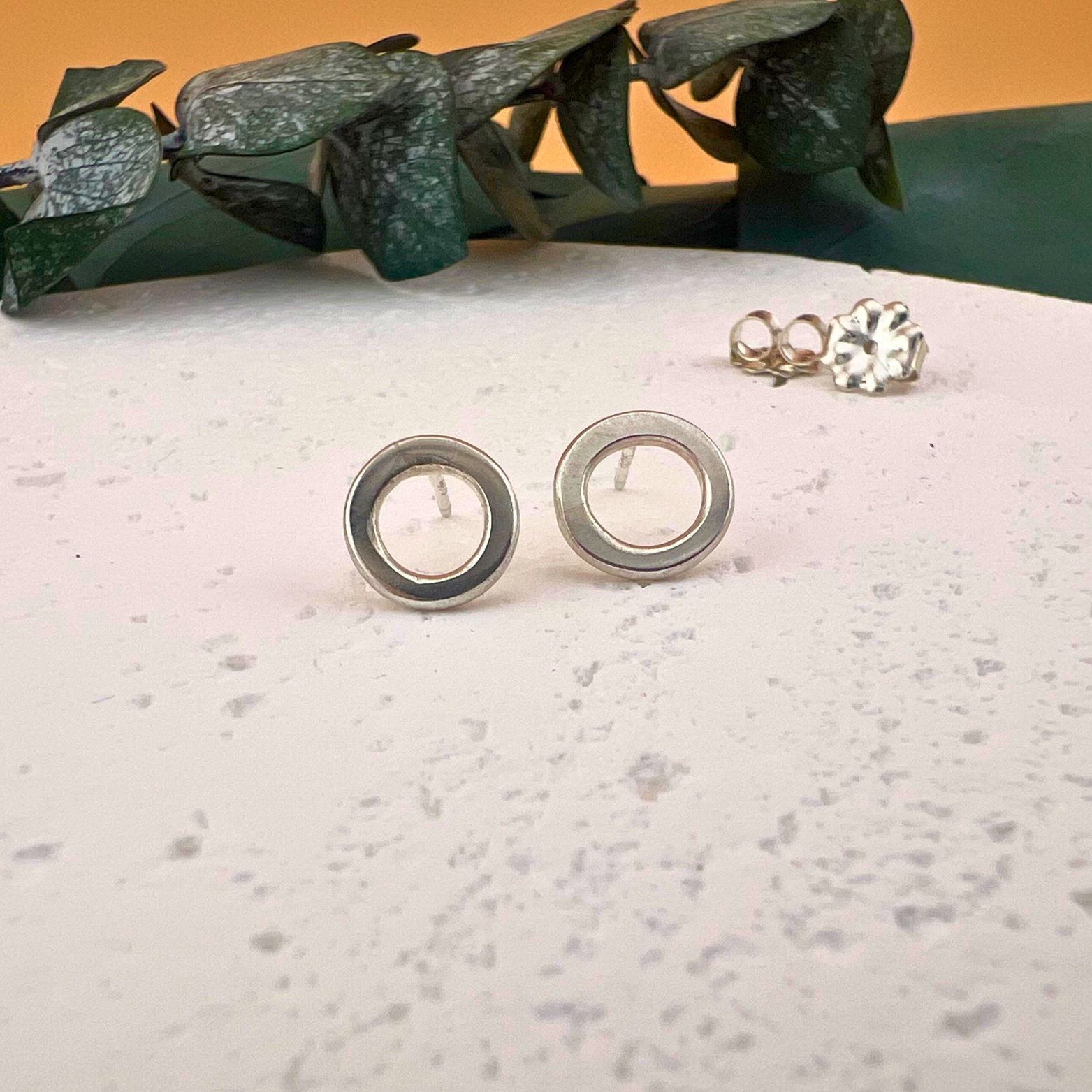 Sol Post Earrings, sterling silver open circle post earrings with an organic, modern design.