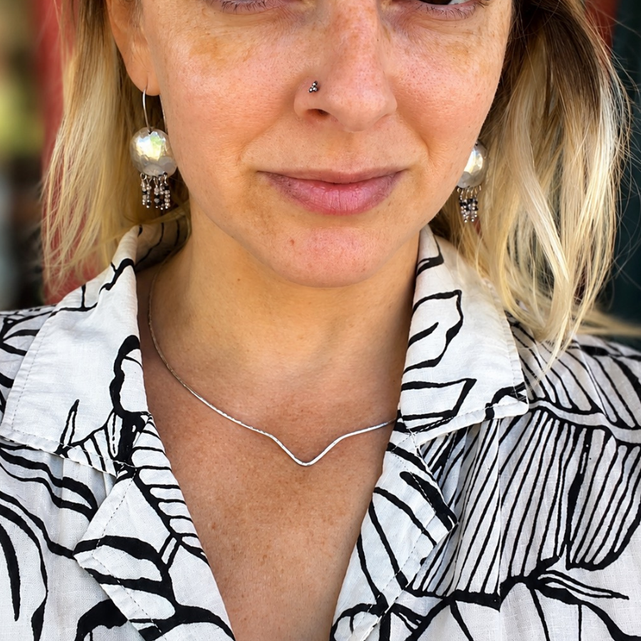 Hand-forged sterling silver Horizon Collar statement necklace by Alison Marie Artisan Jewelry, lightweight 17-inch sculptural collar with a modern minimalist design.