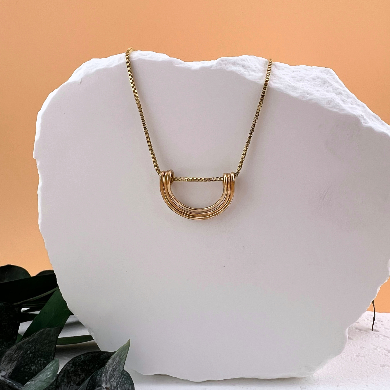 Gold fill Simplicity Arc necklace on a delicate chain.