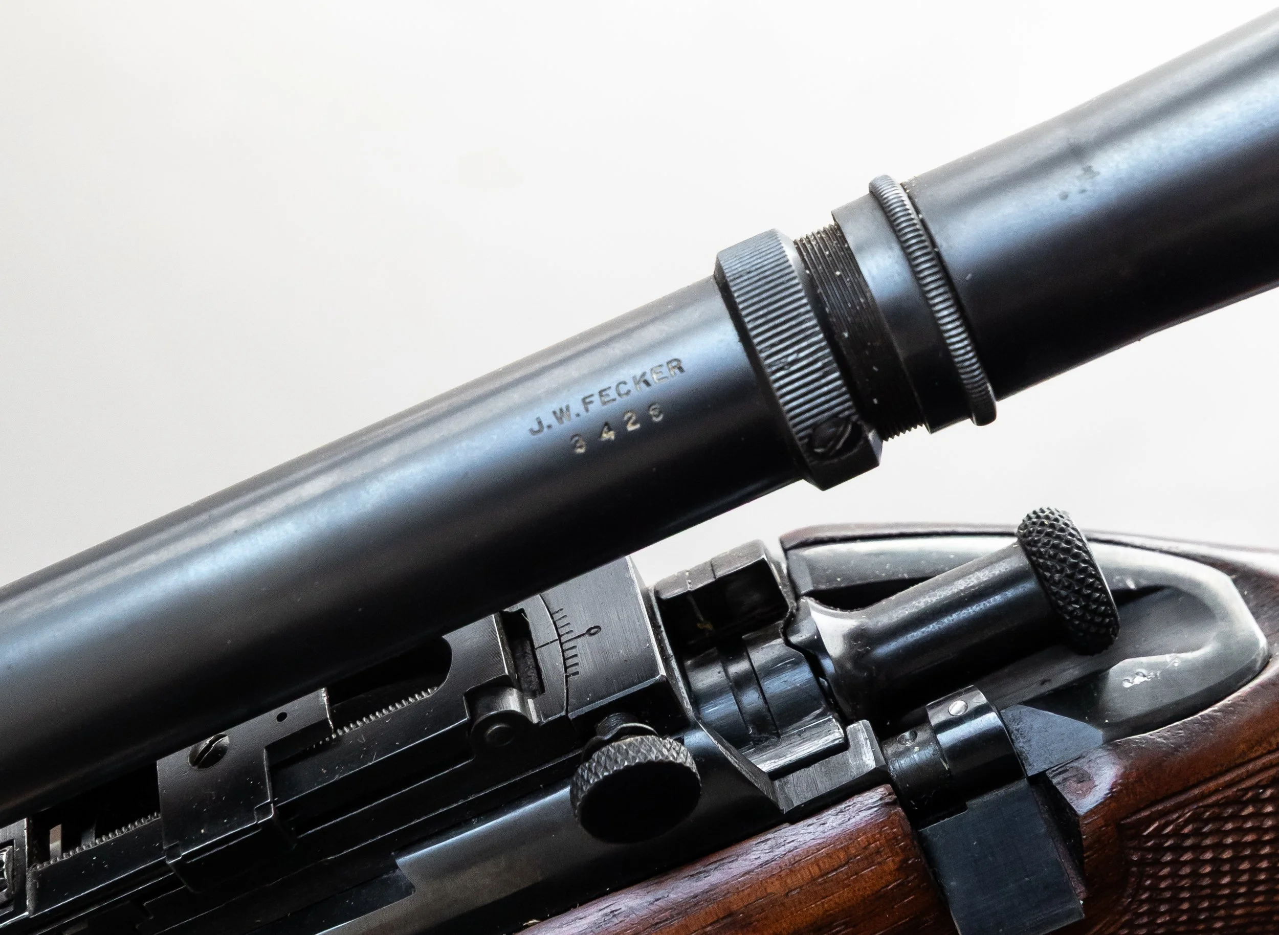 12 - Winchester Model 52, .22 long rifle target, Serial # 4 digits (buried in the wood), Pre 1927, w/ J.W. Fecker scope 3426 external adjustment, correct front and rear site, front site removable, restocked, upgraded with new stock, barrel length 24”