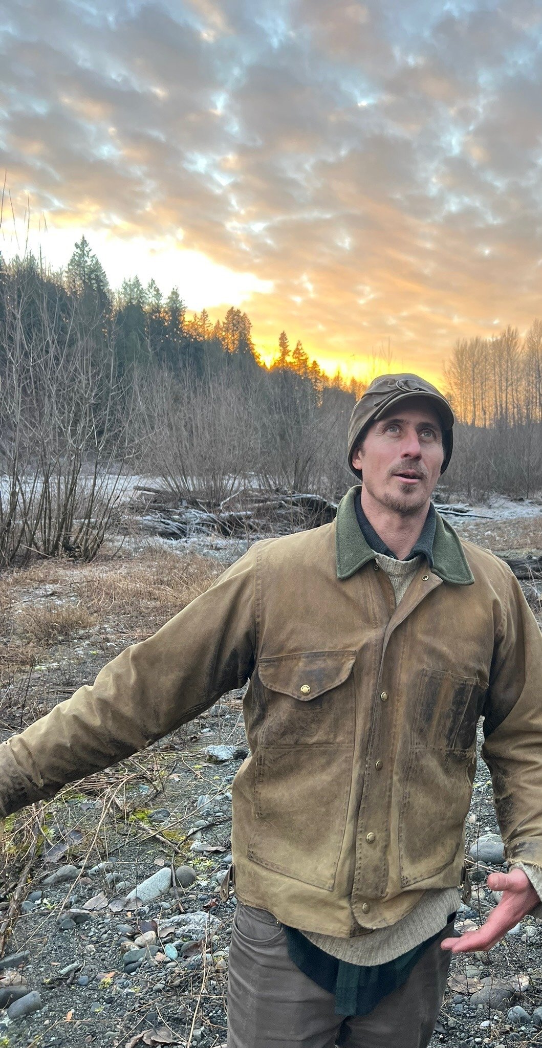 Mark Thompson teaching animal tracking on a riverbank