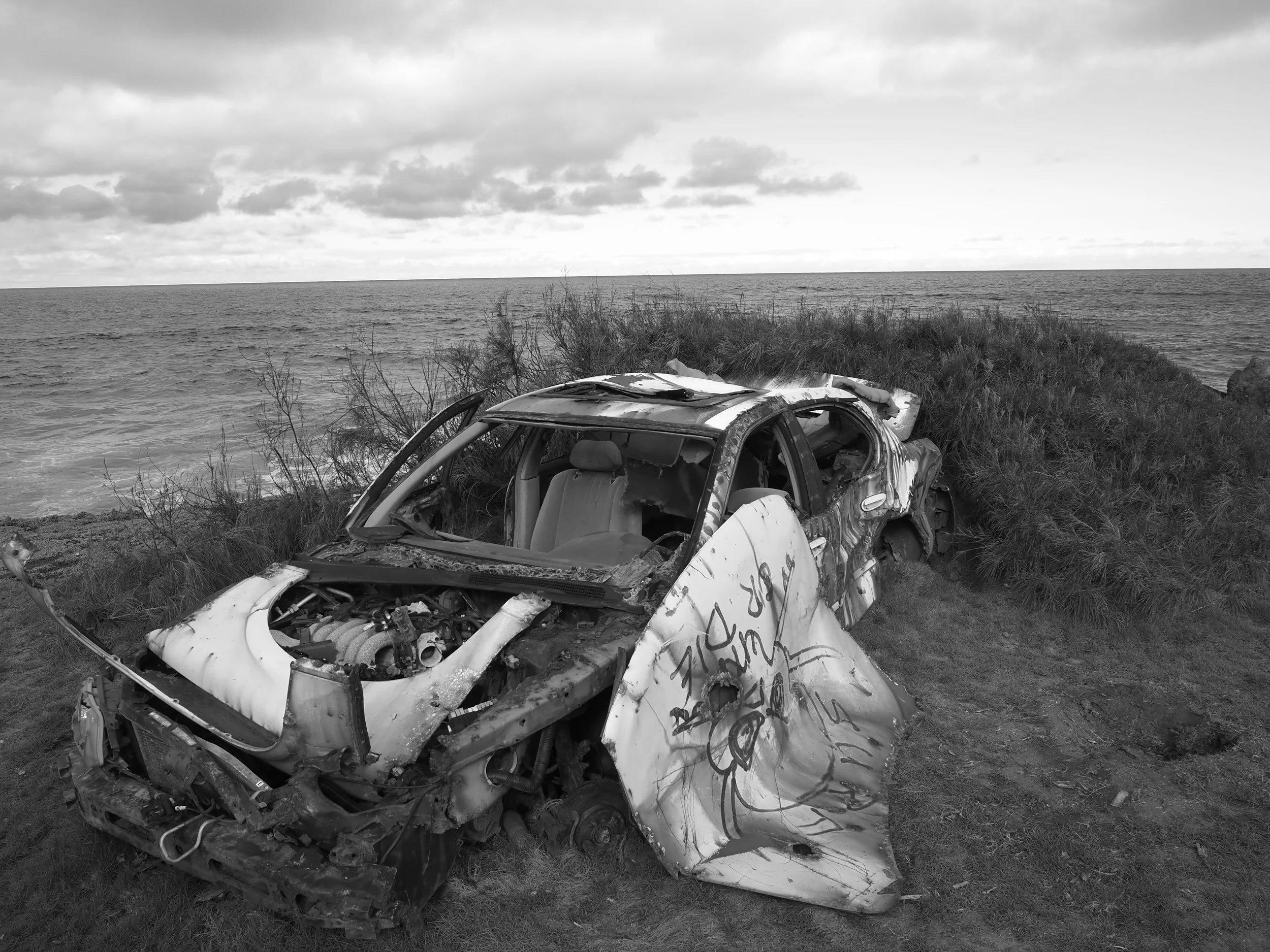old car and beach in Hawaii black and white