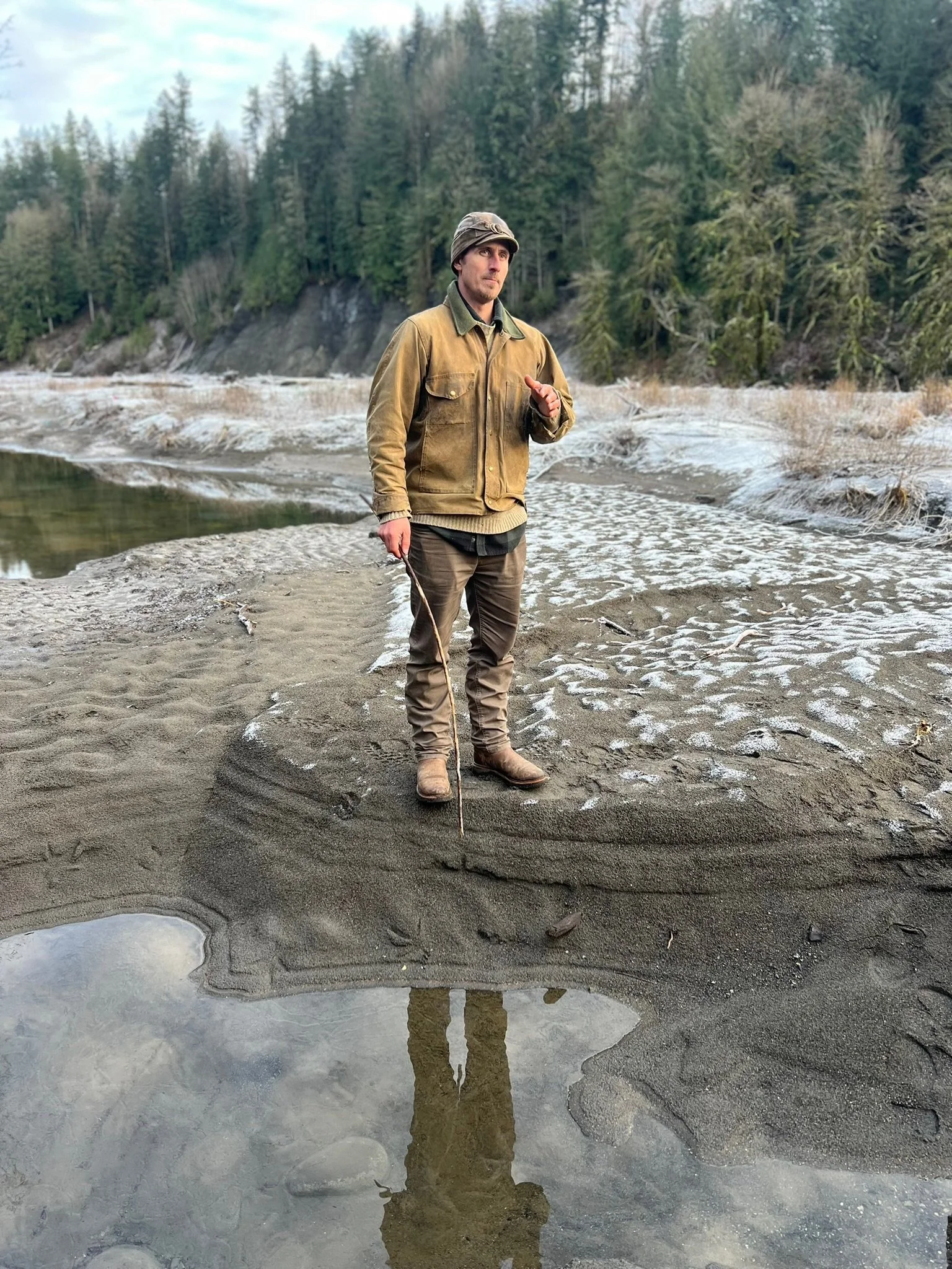 Mark Thompson teaching about bald eagle tracks on a river bank