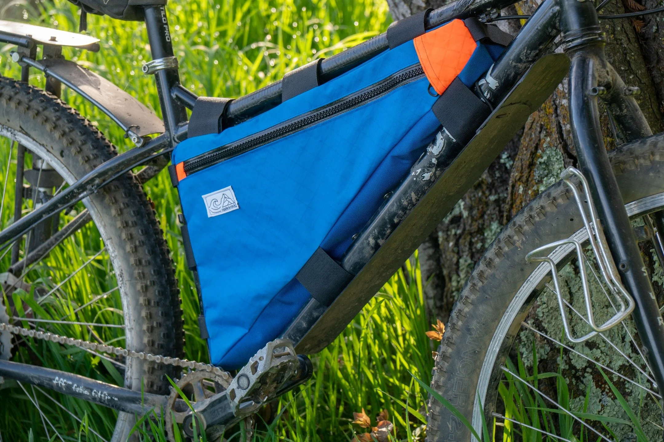 Getting back to my gear making roots on this one. My first ever bag project was a bikepacking frame bag made from a repurposed military duffel bag using a borrowed sewing machine. That bag was funky, functional, and super fun to build and use! I've b