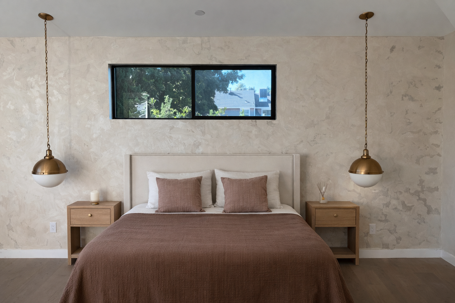 Cozy modern bedroom with soft lighting.png