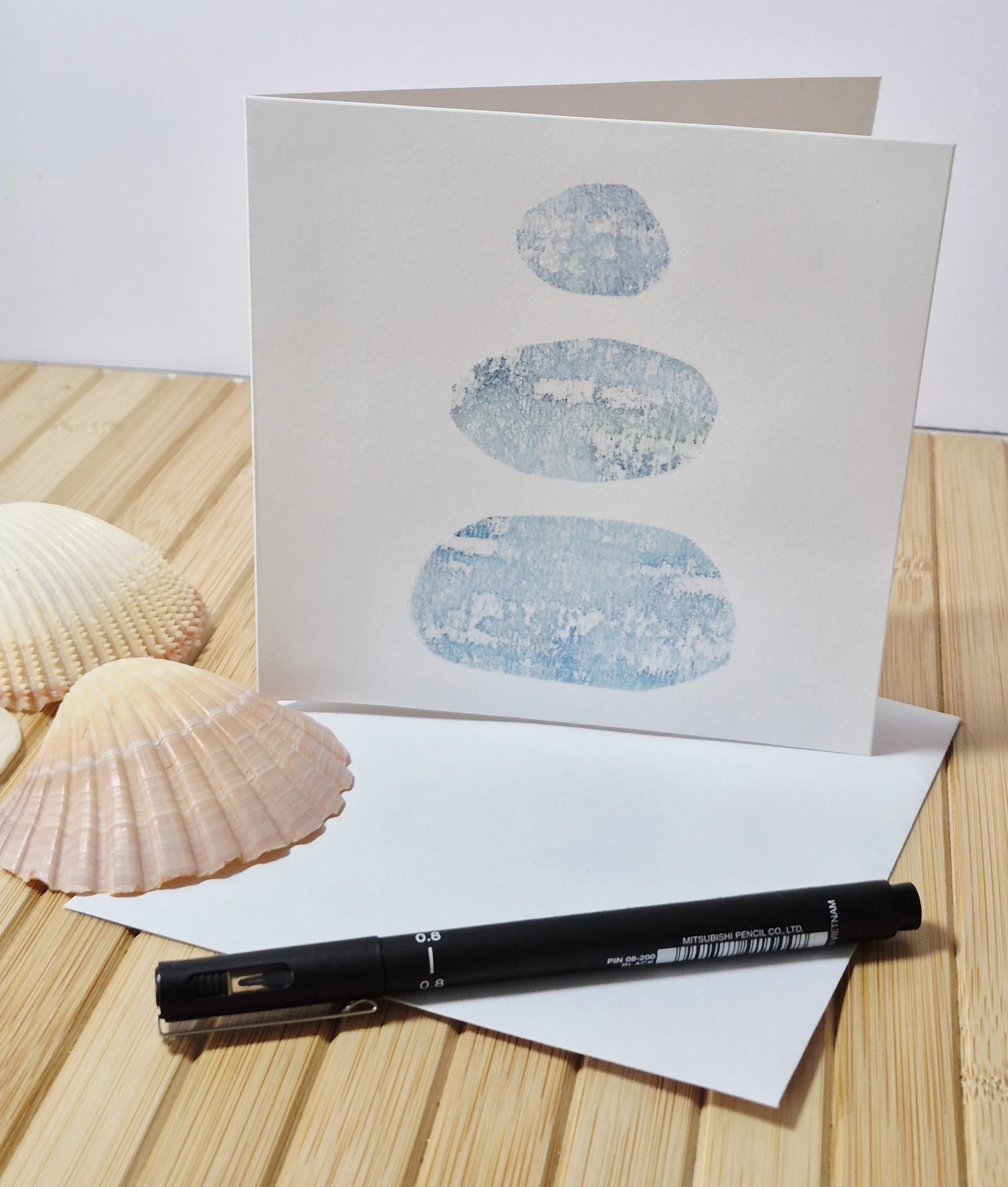 Pebbles by the beach side card