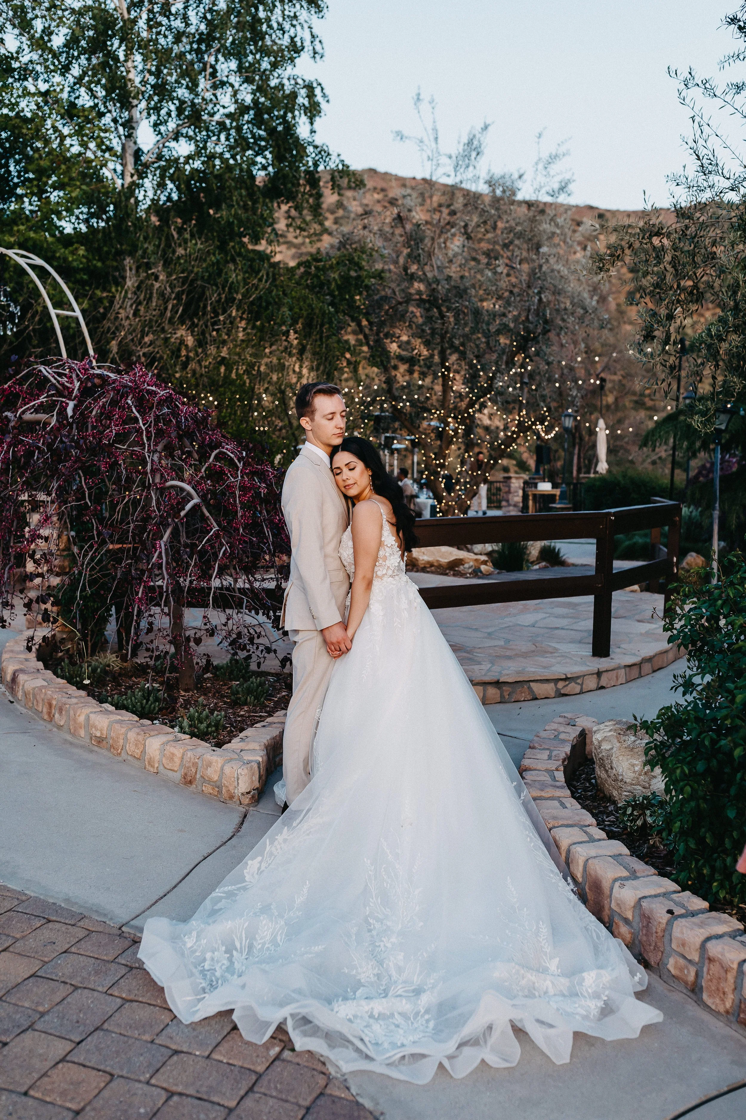 a bride and groom taking intimate wedding portraits during blue hour at Serendipity Garden Weddings in Yucaipa, California.