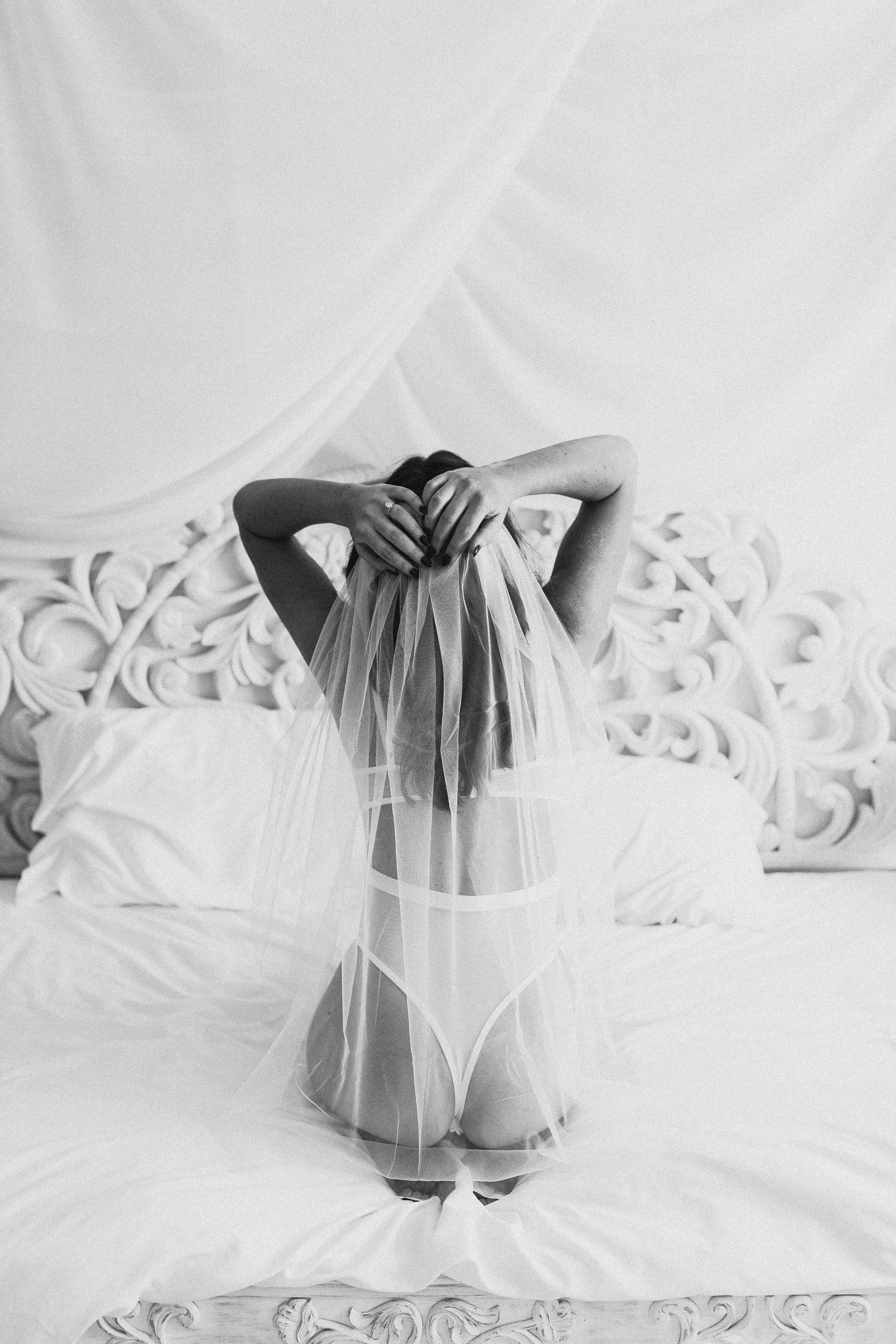 bride in matching white lingerie set with long veil