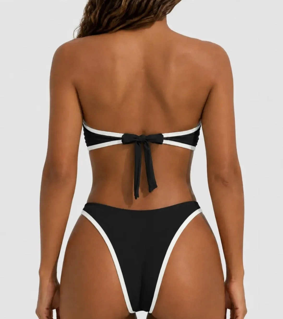Luxury Black swim suit with gold detail middle of bust, back view