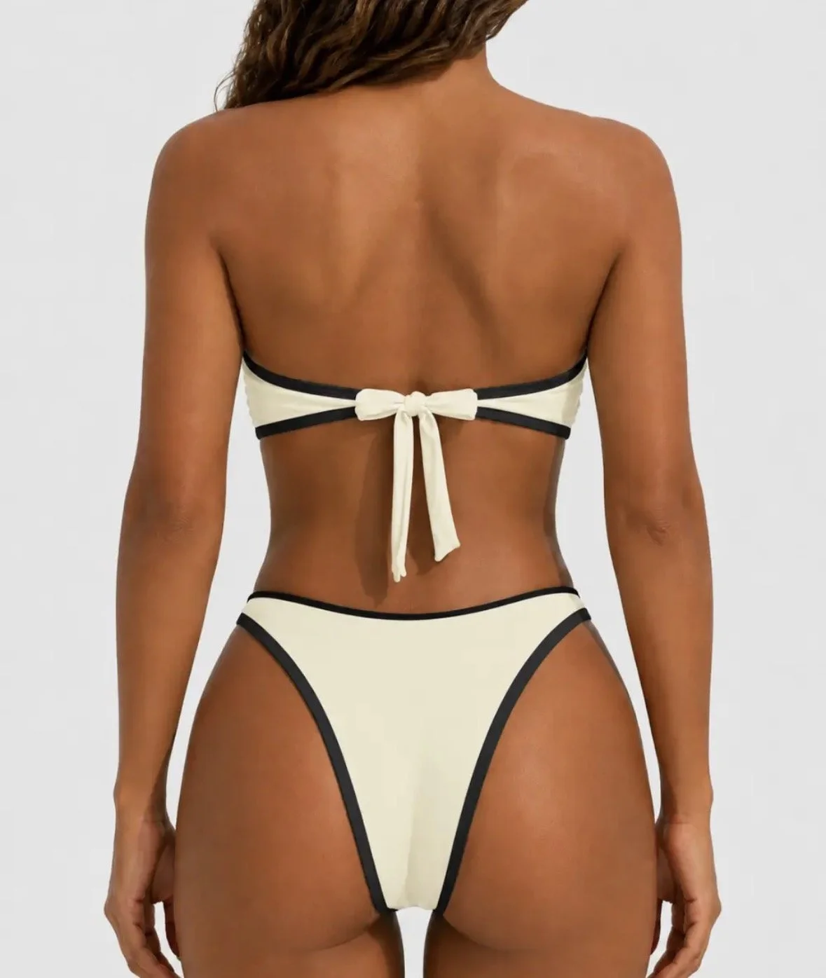 Luxury white with black trim swim suit with gold detail middle of bust
