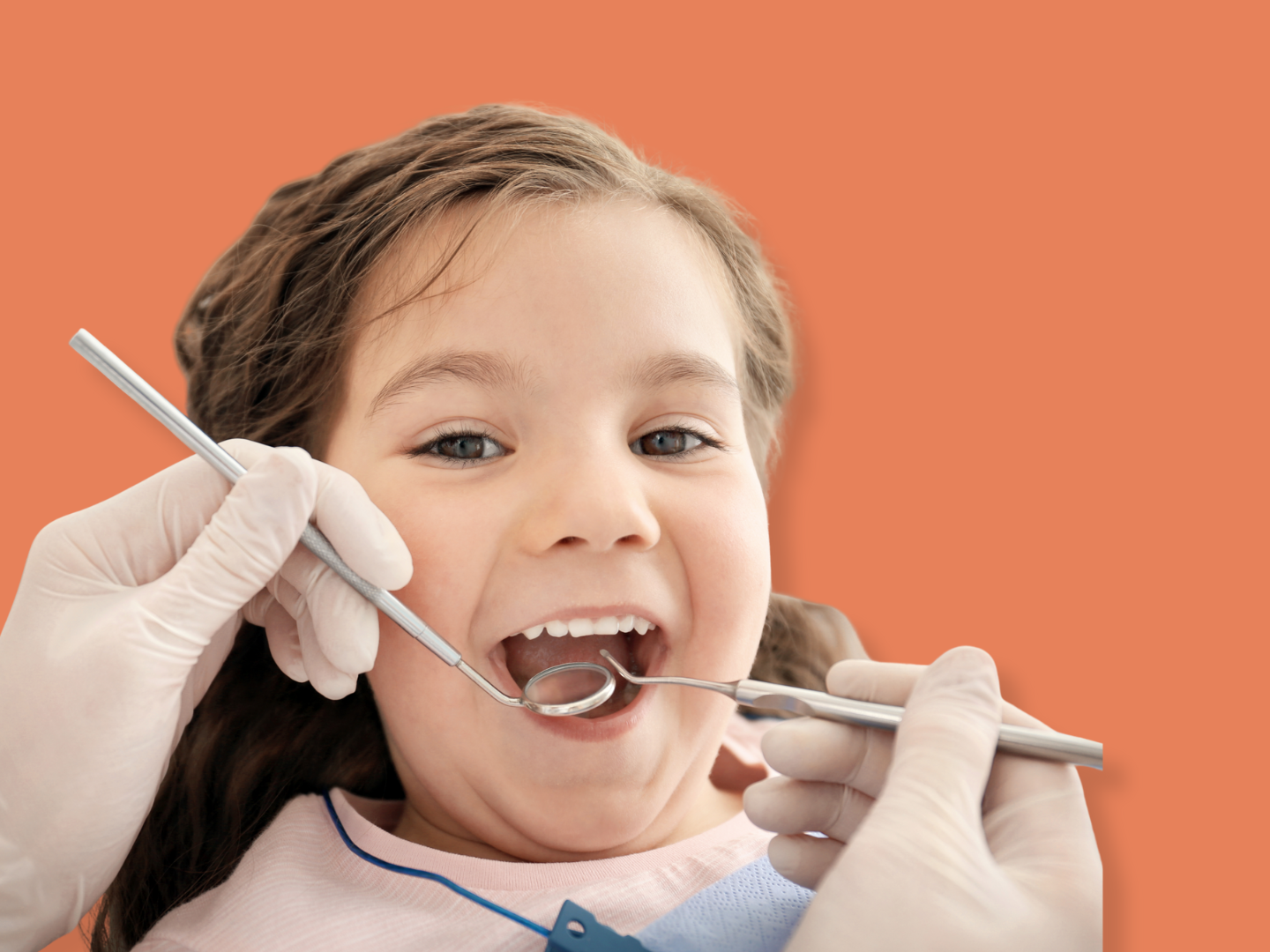 A young girl at the dentist's office is having her mouth examined with dental tools by a dental professional wearing white gloves.