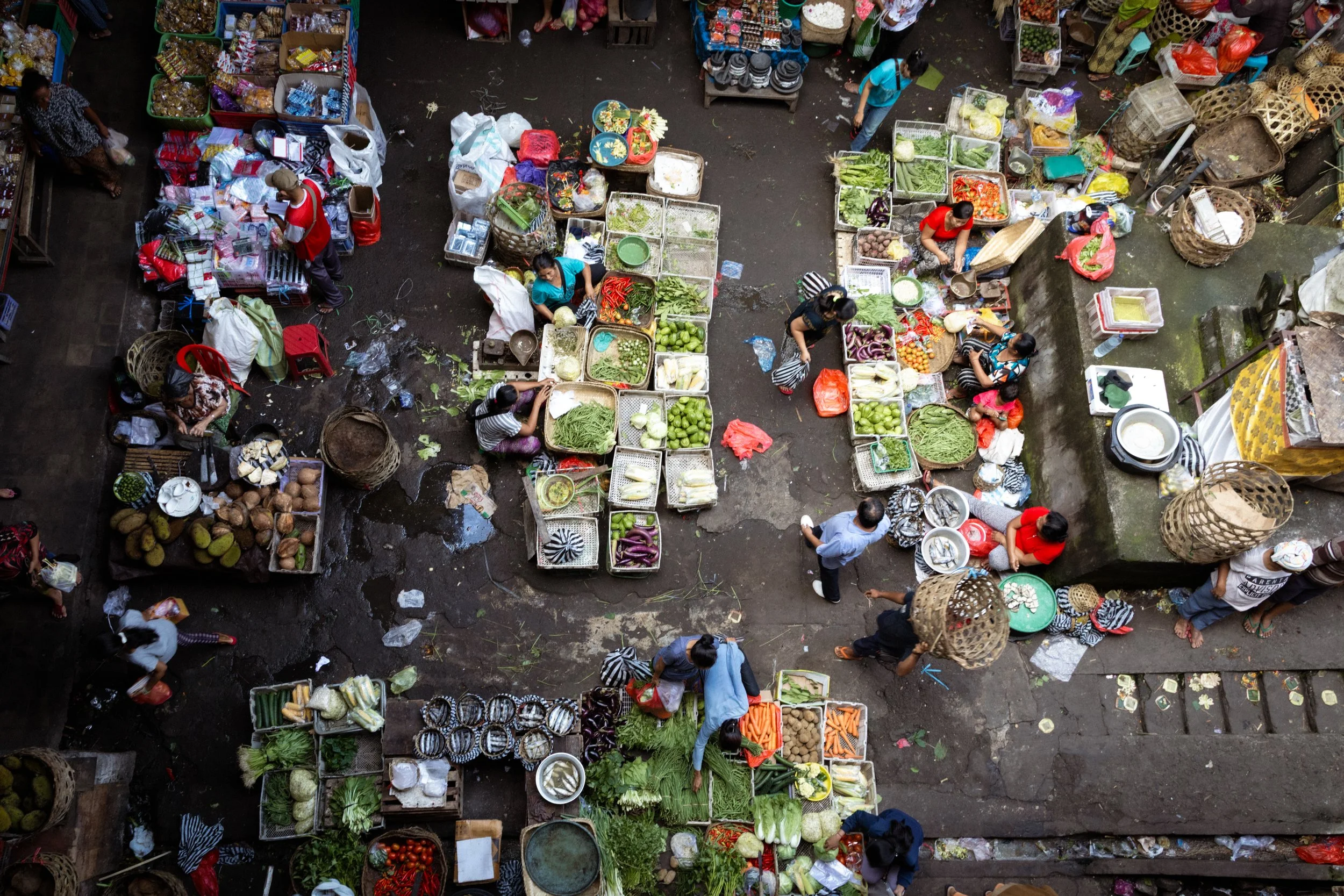 People navigate around the Ubud food market. Bali, Indonesia, 2017