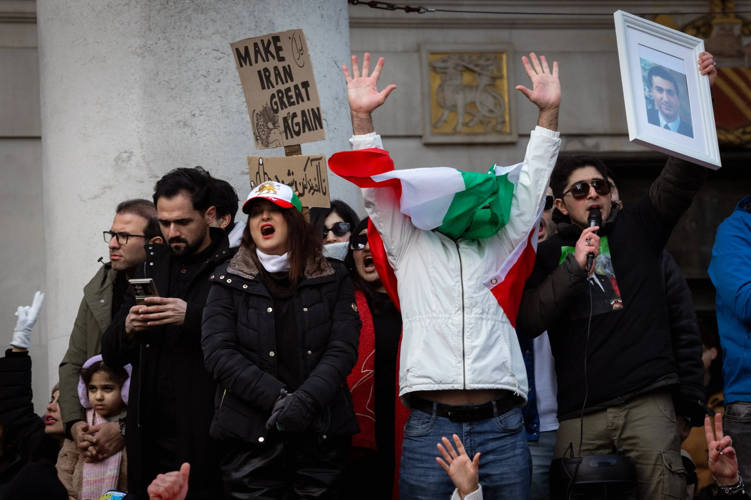 Iranian supporters cheer during an anti-Iranian government protest outside the Central Library in St Peter's Square. 