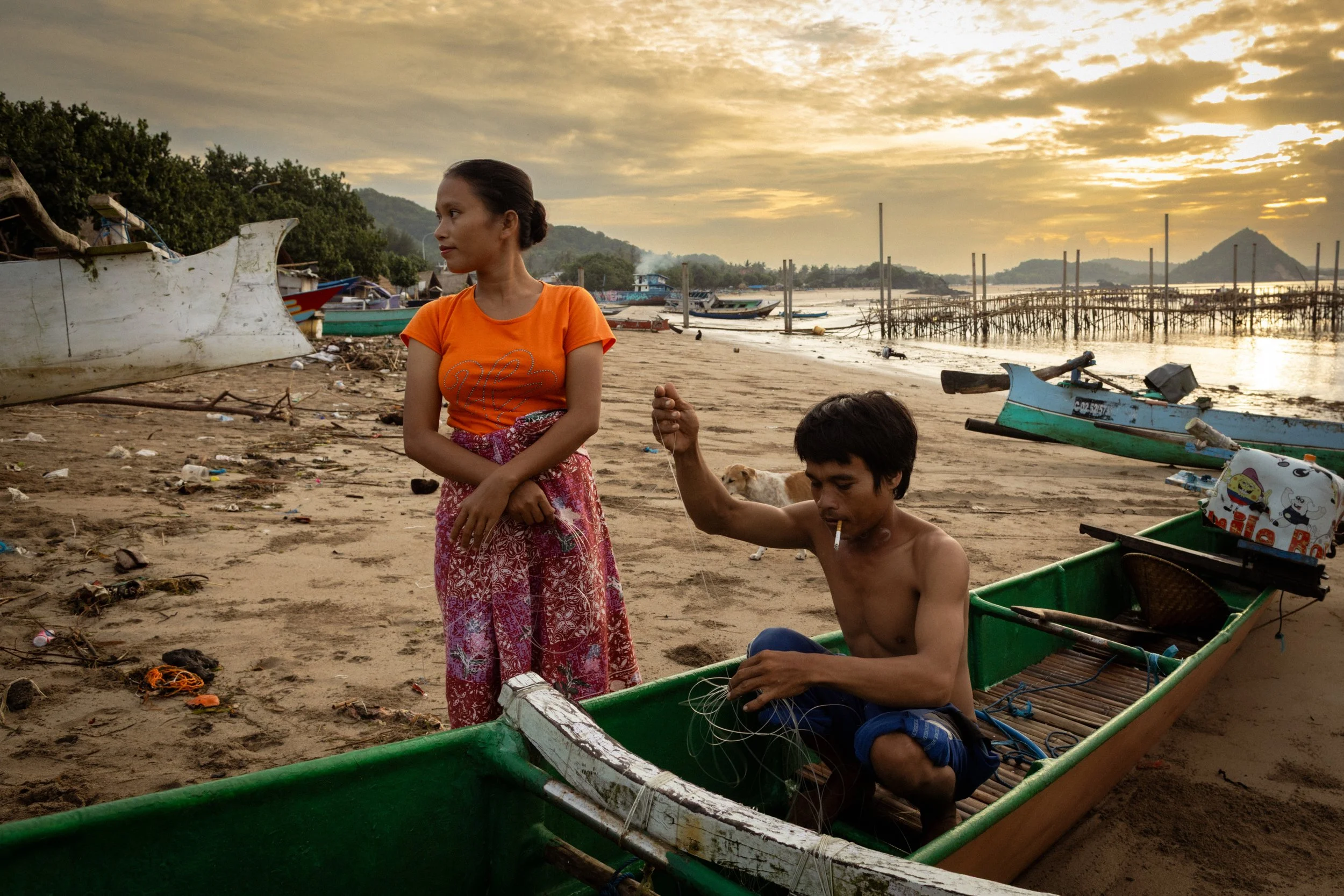 A fisherman and his wife prepare fishing nets before heading out to sea. Lombok, Indonesia, 2017