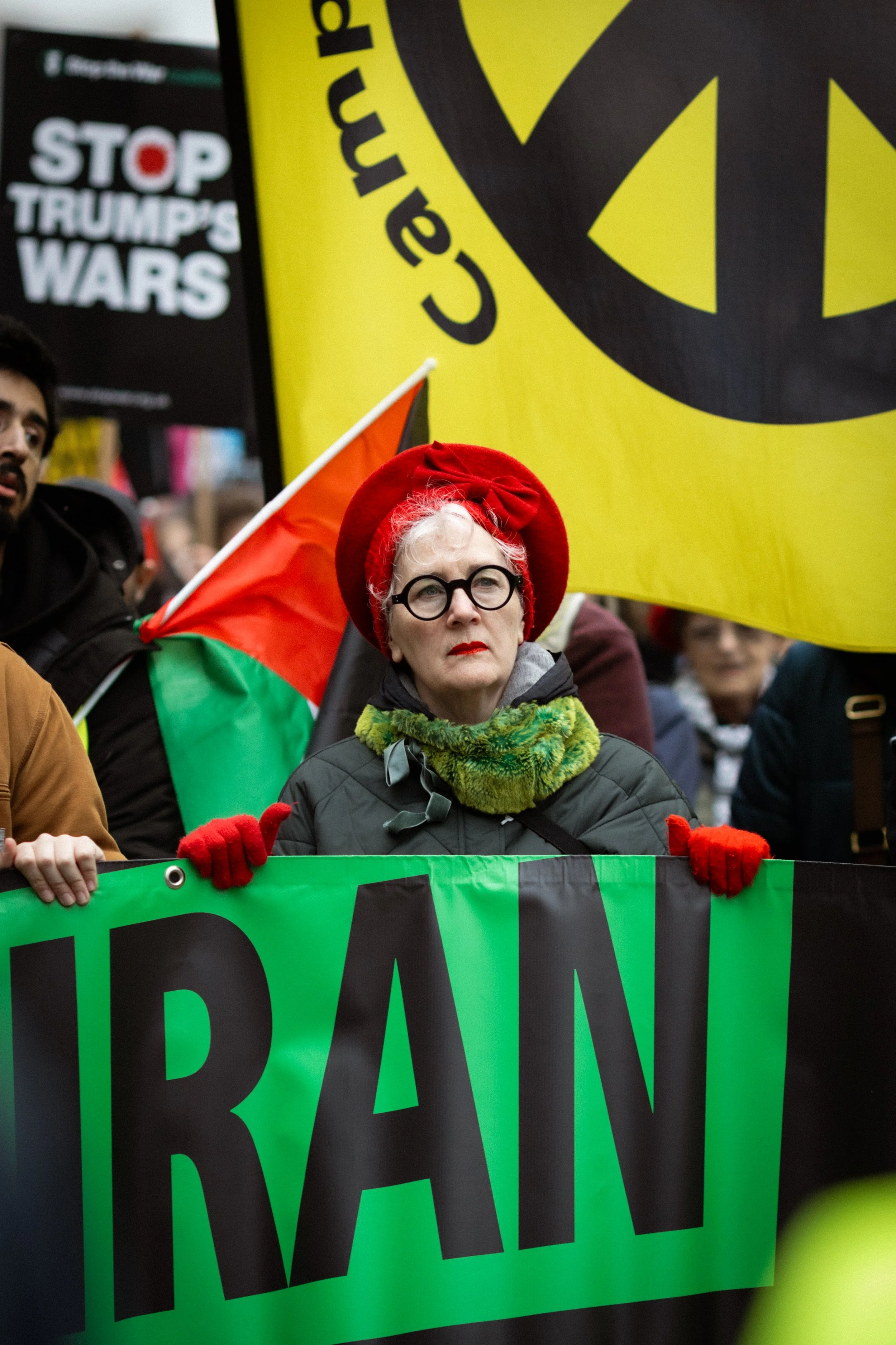 An Iranian supporter marches through the city to protest against the bombing of Iran. 