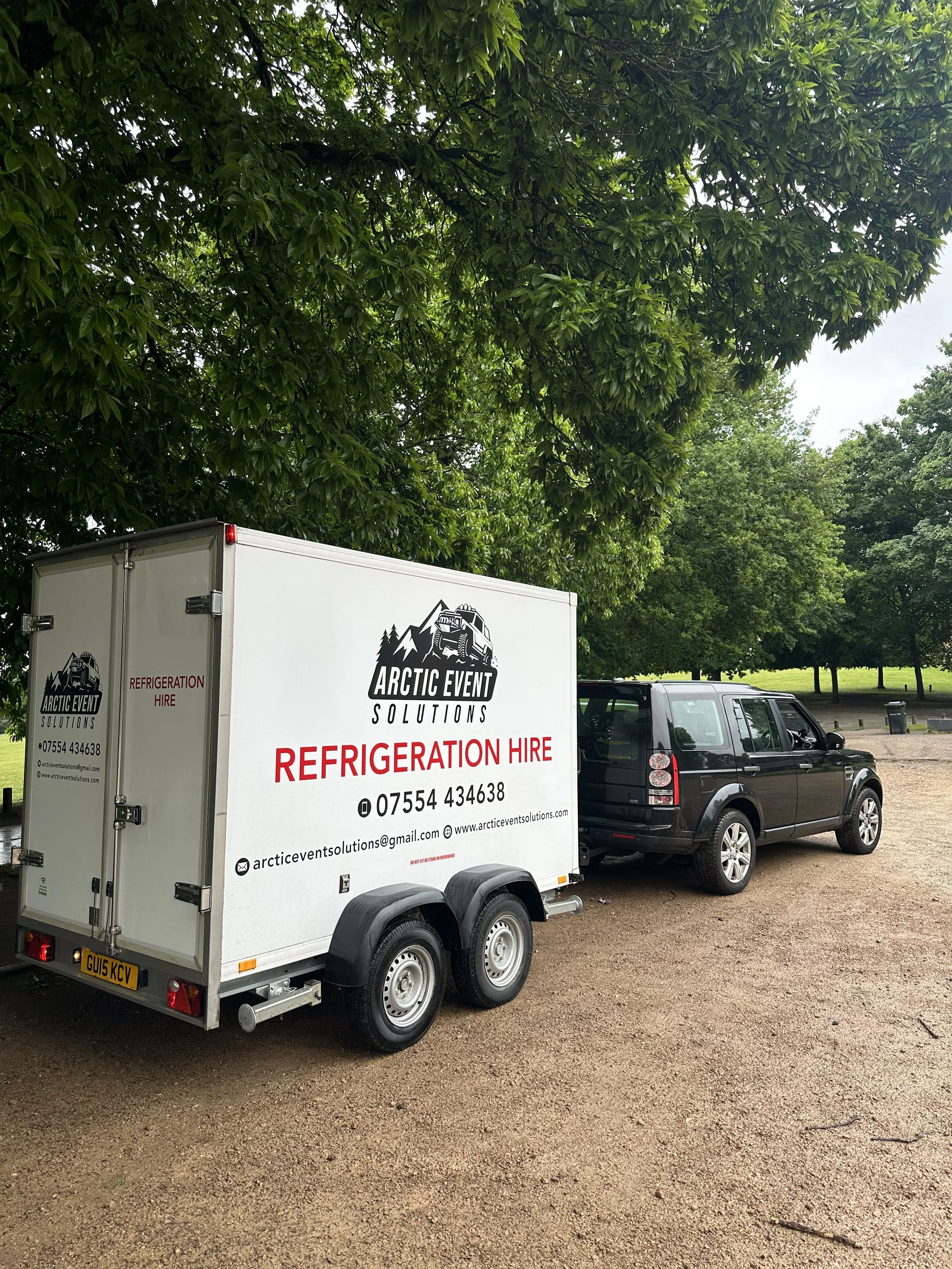 Modern refrigerated trailer parked at outdoor event in Berkshire countryside