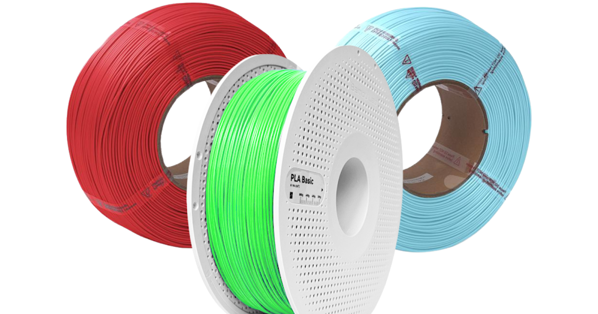 Three rolls of 3D printer filament in red, green, and blue colors.