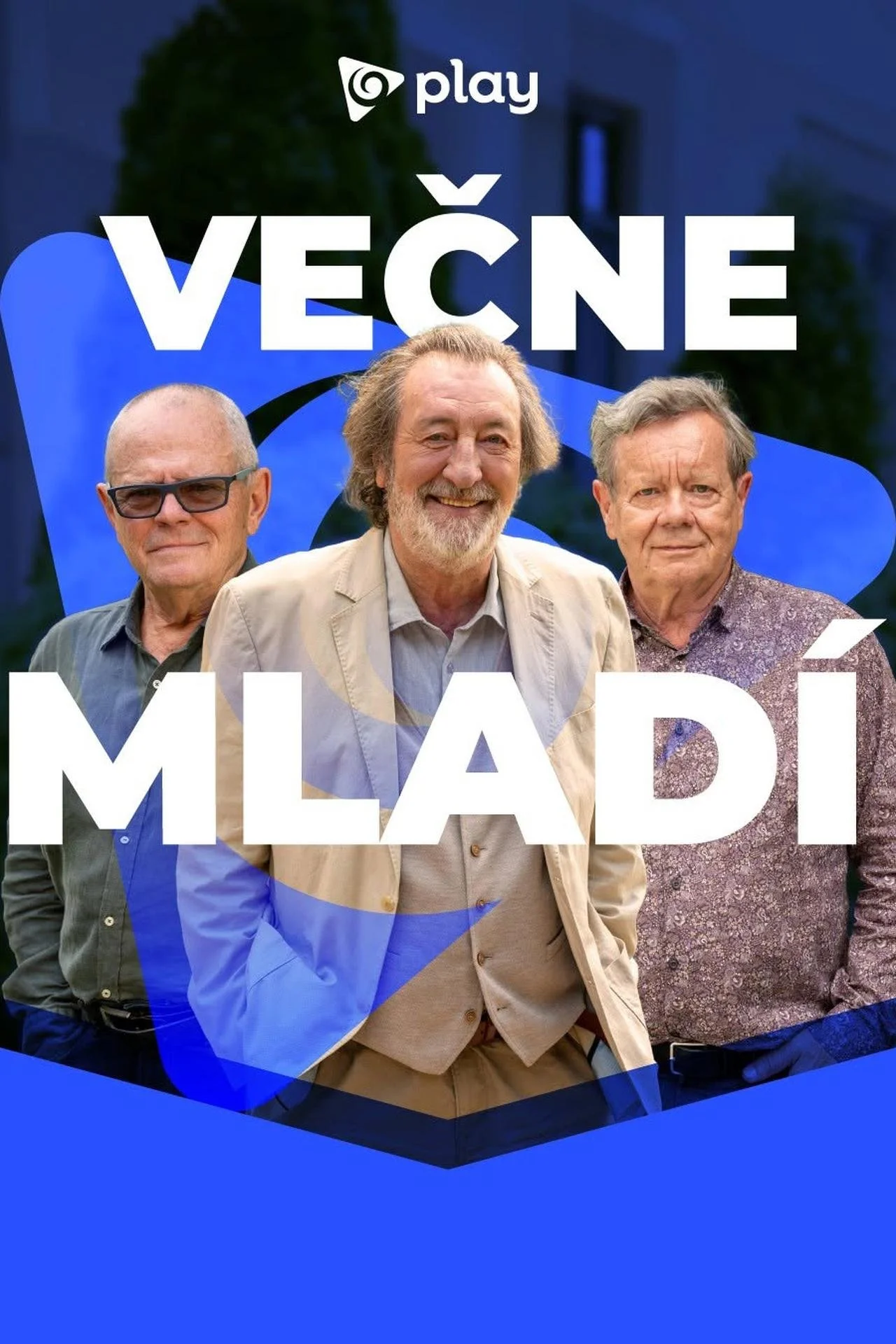 A promotional poster for a show called 'Večne Mlado' featuring three elderly men standing outdoors, with one smiling broadly in the center. The background has blue and black design elements, and the title is prominently displayed in white text.