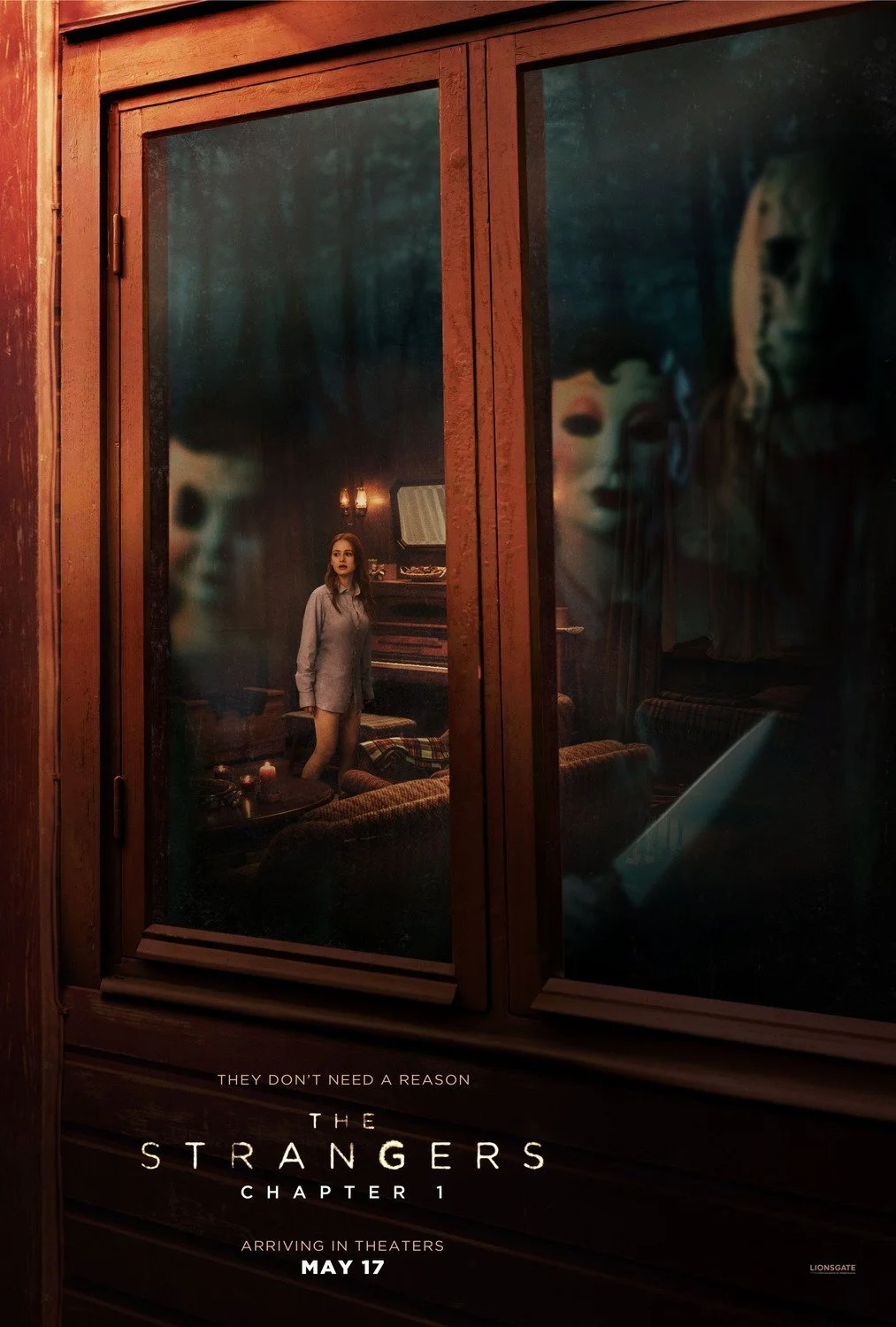A poster for the movie "The Strangers: Chapter 1" showing a woman looking through a window at spooky masks reflected on the glass, with the release date May 17.