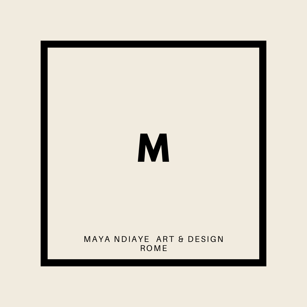 Cover of an art and design exhibition catalog featuring a large letter 'M' in the center, with text below that reads 'MAYA NDIAYE ART & DESIGN ROME'.